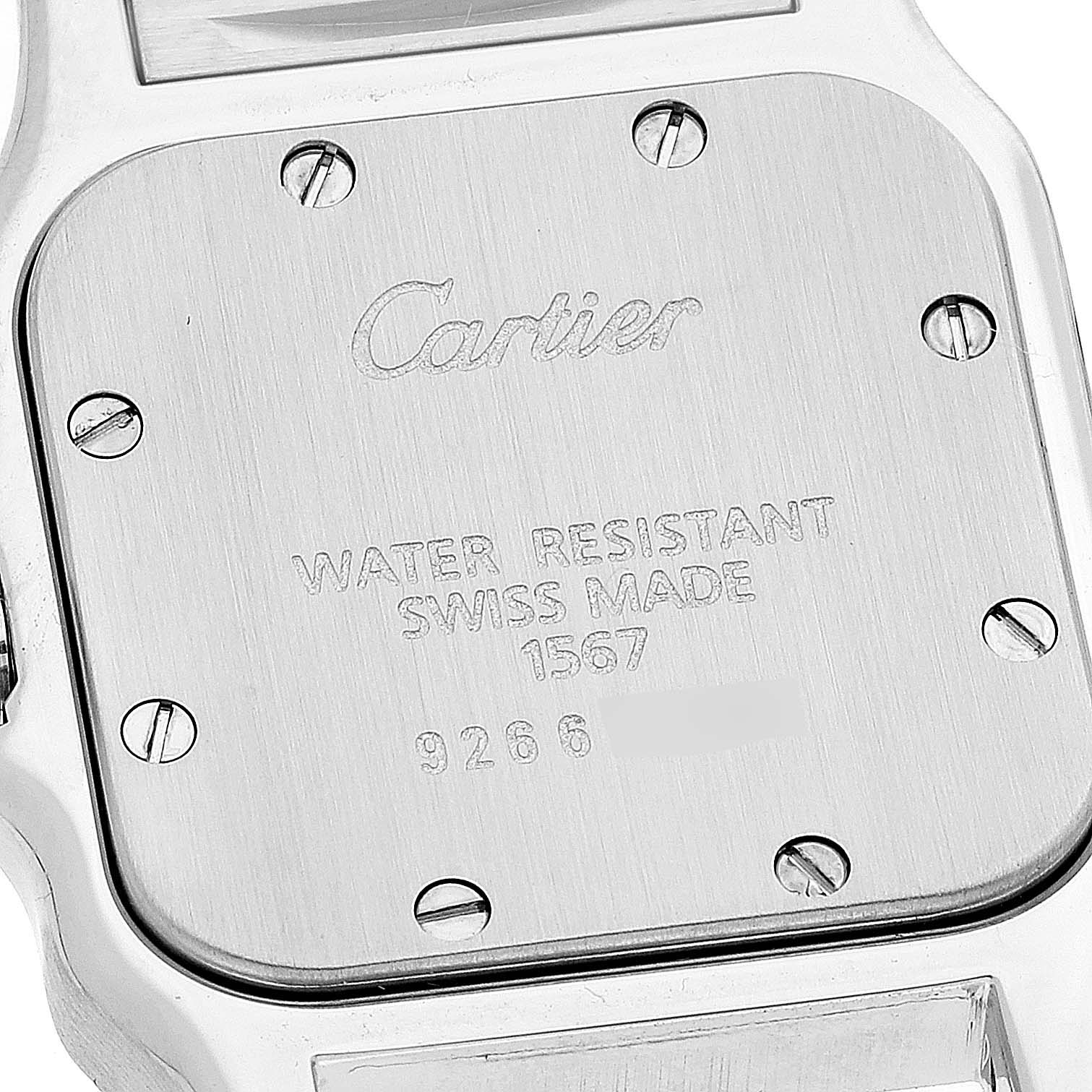The image shows the case back of a Santos model by Cartier inscribed with "Cartier," "Water Resistant," "Swiss Made," model number, and serial number.