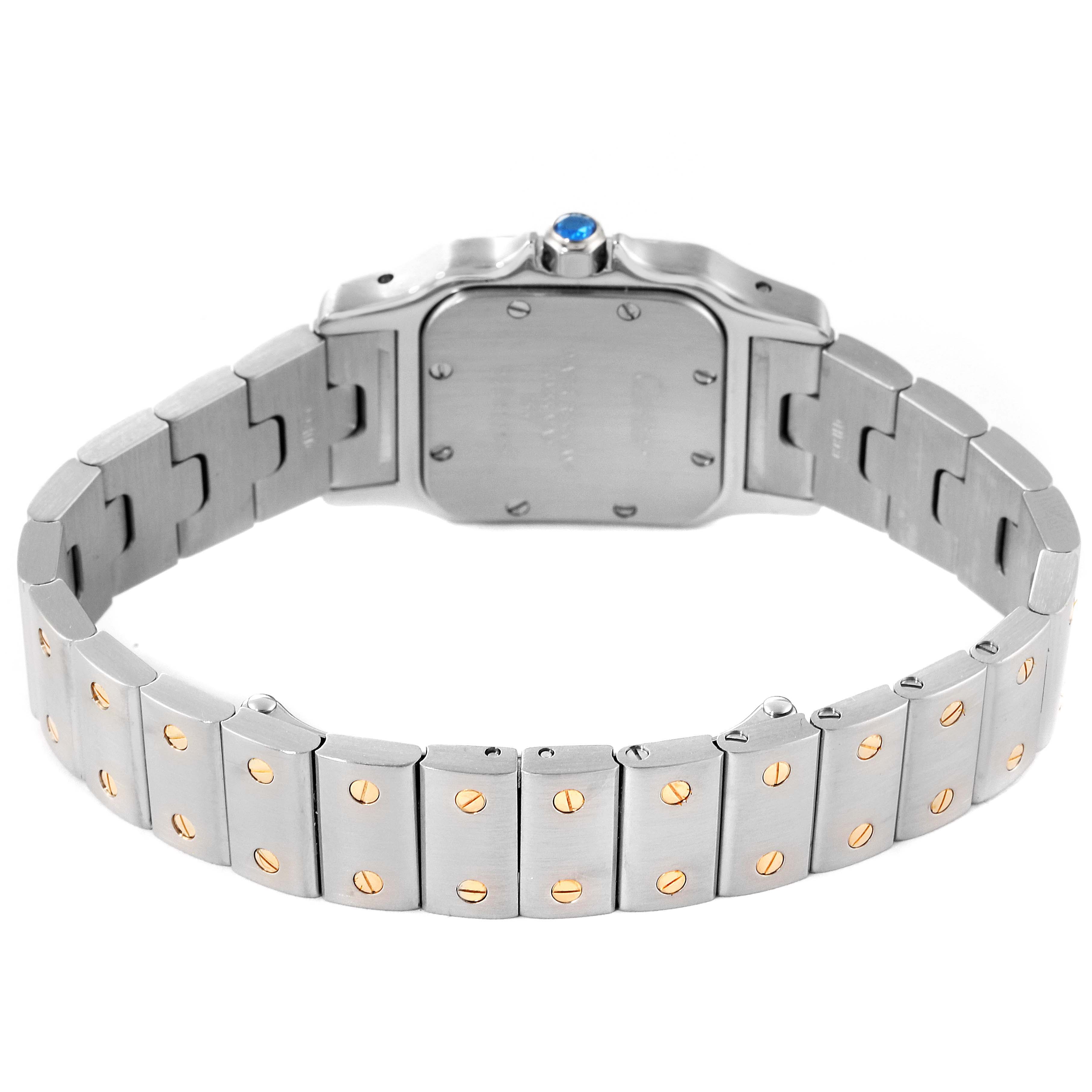 This image shows the back view of the Cartier Santos W20012C4 Women's Steel and Gold (two tone) Silver Dial W20012C4 Women's Steel and Gold (two tone) Silver Dial model, highlighting its metal bracelet and screw details.