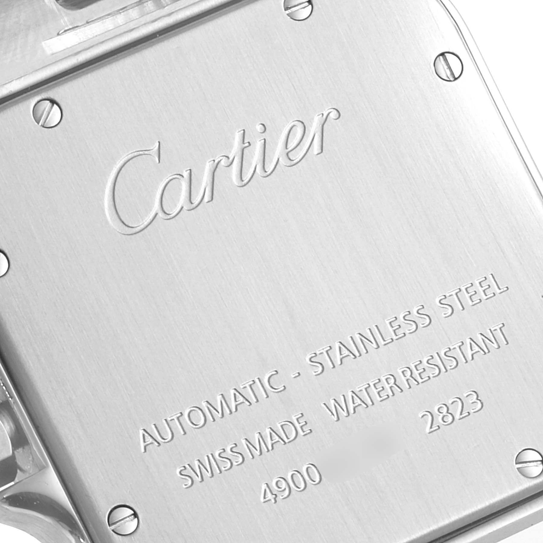 This image shows the case back of a Cartier Santos W20098D6 Men
s Stainless Steel Silver Dial W20098D6 Men
s Stainless Steel Silver Dial watch, displaying its engraving and screws.