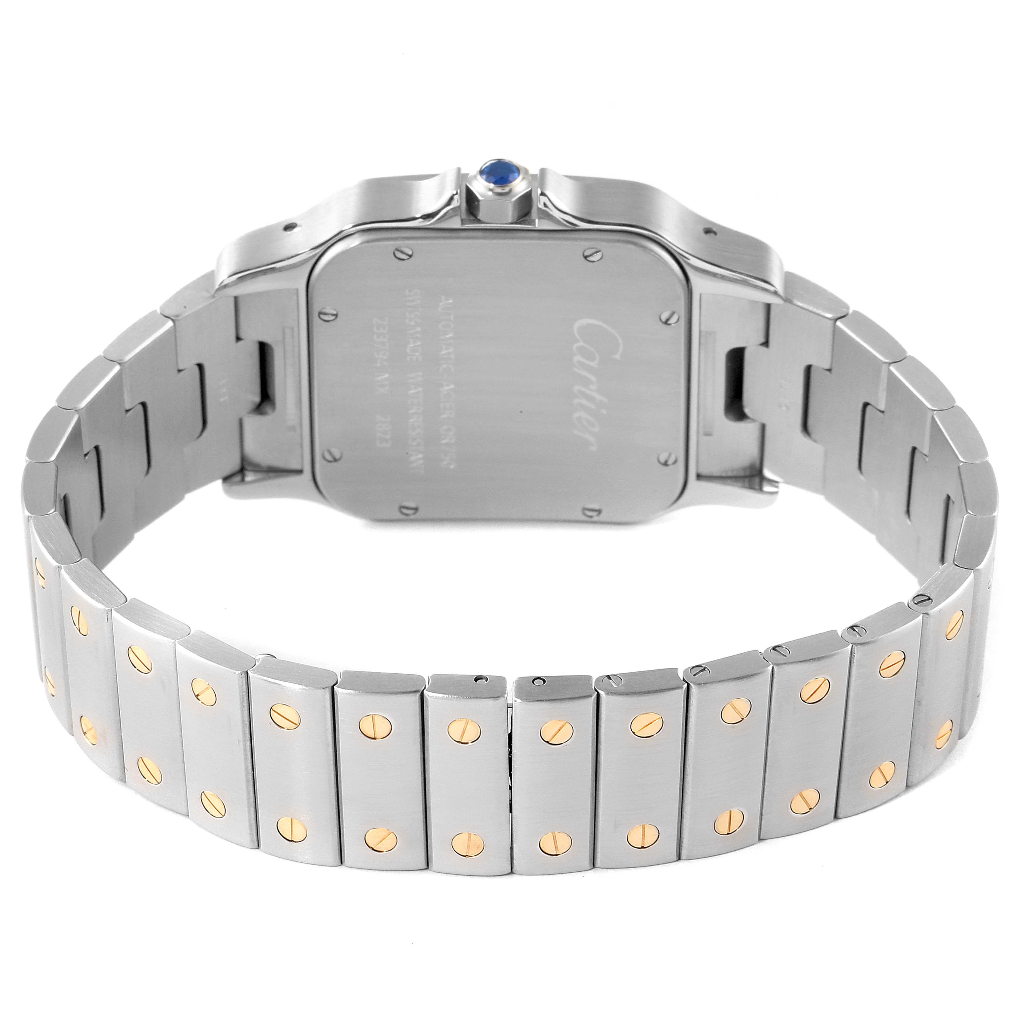 This image shows the back and bracelet of a Santos model by Cartier, highlighting the case back and metal links with gold screws.
