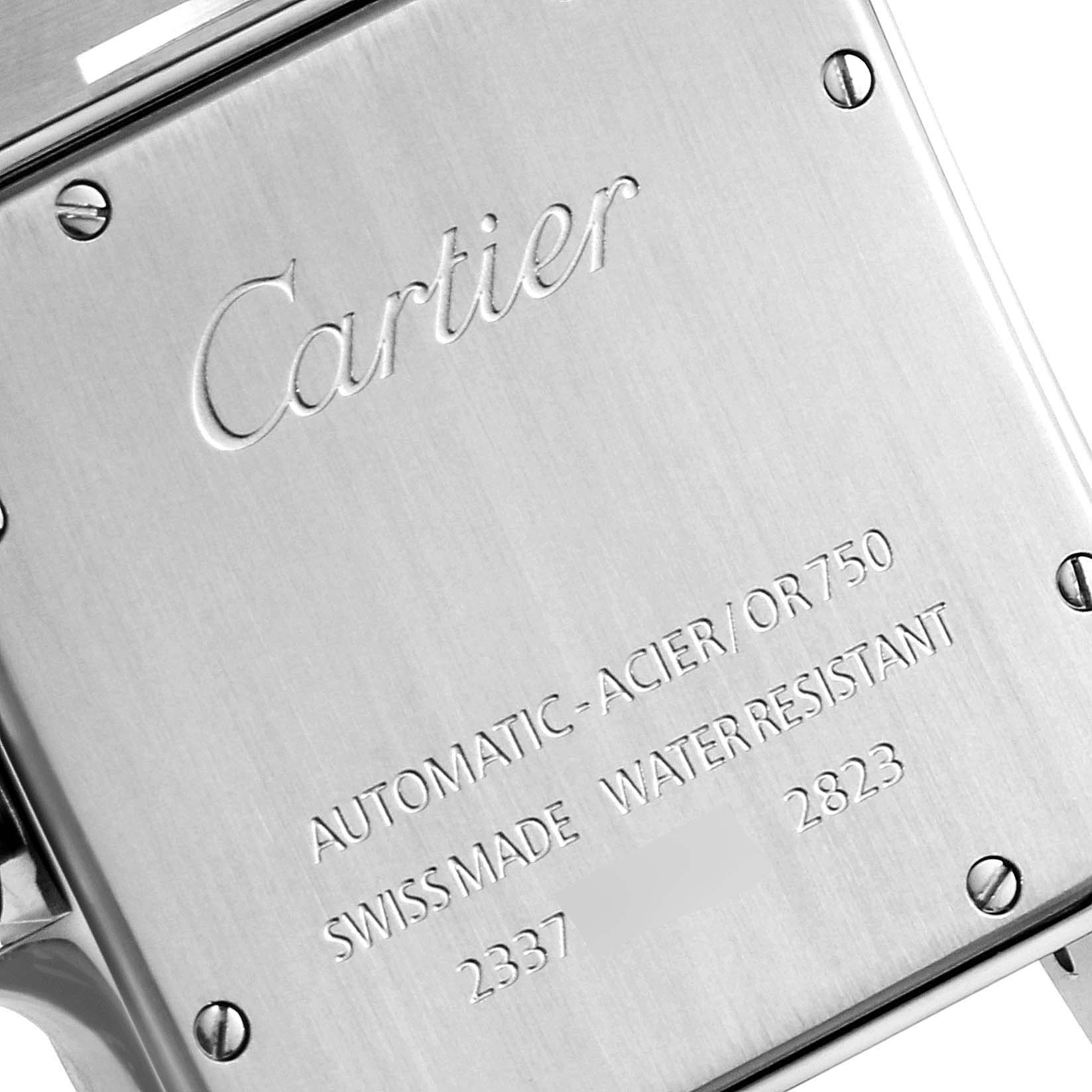 The image shows the back cover of a Santos model by Cartier, highlighting the engraving and screws.