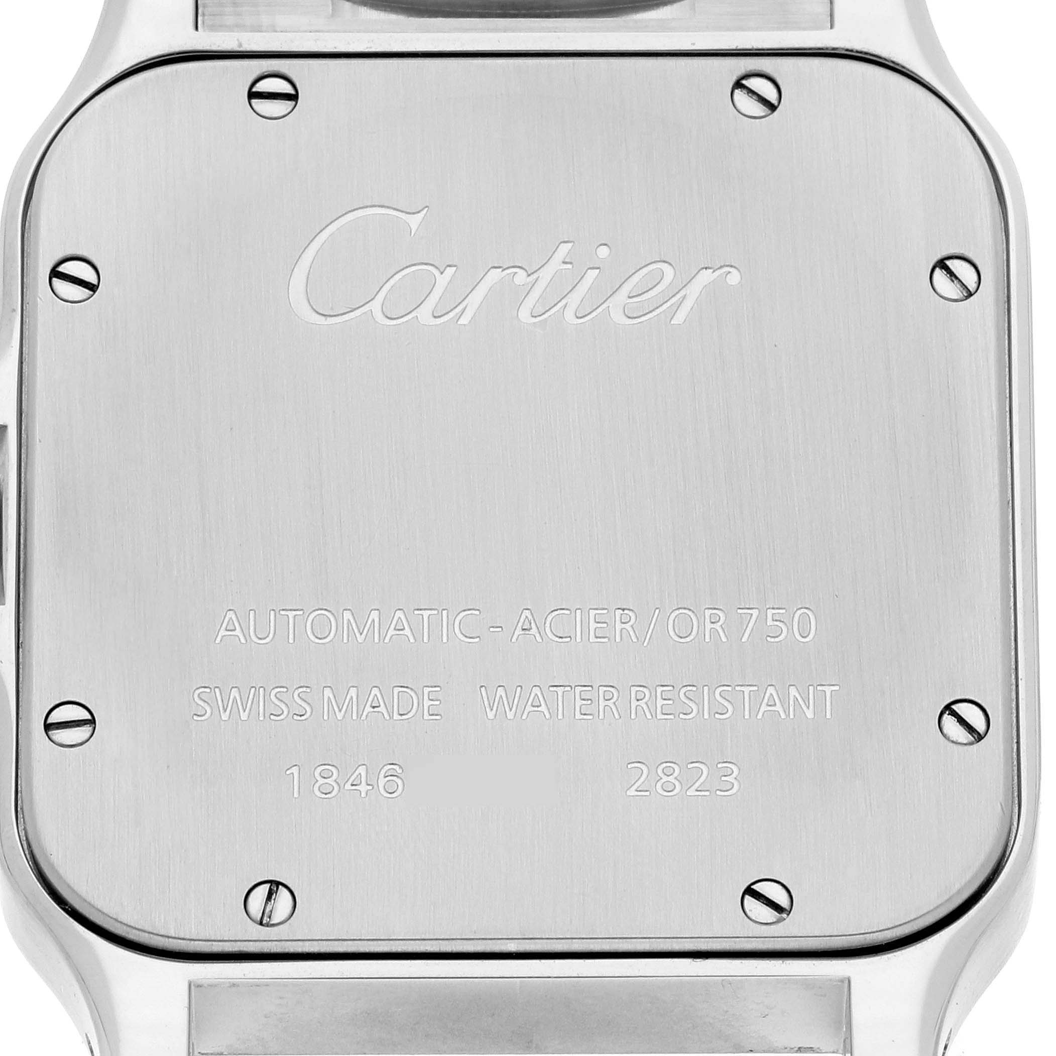 This image shows the case back of a Santos model watch by Cartier, featuring engraved details and screws.