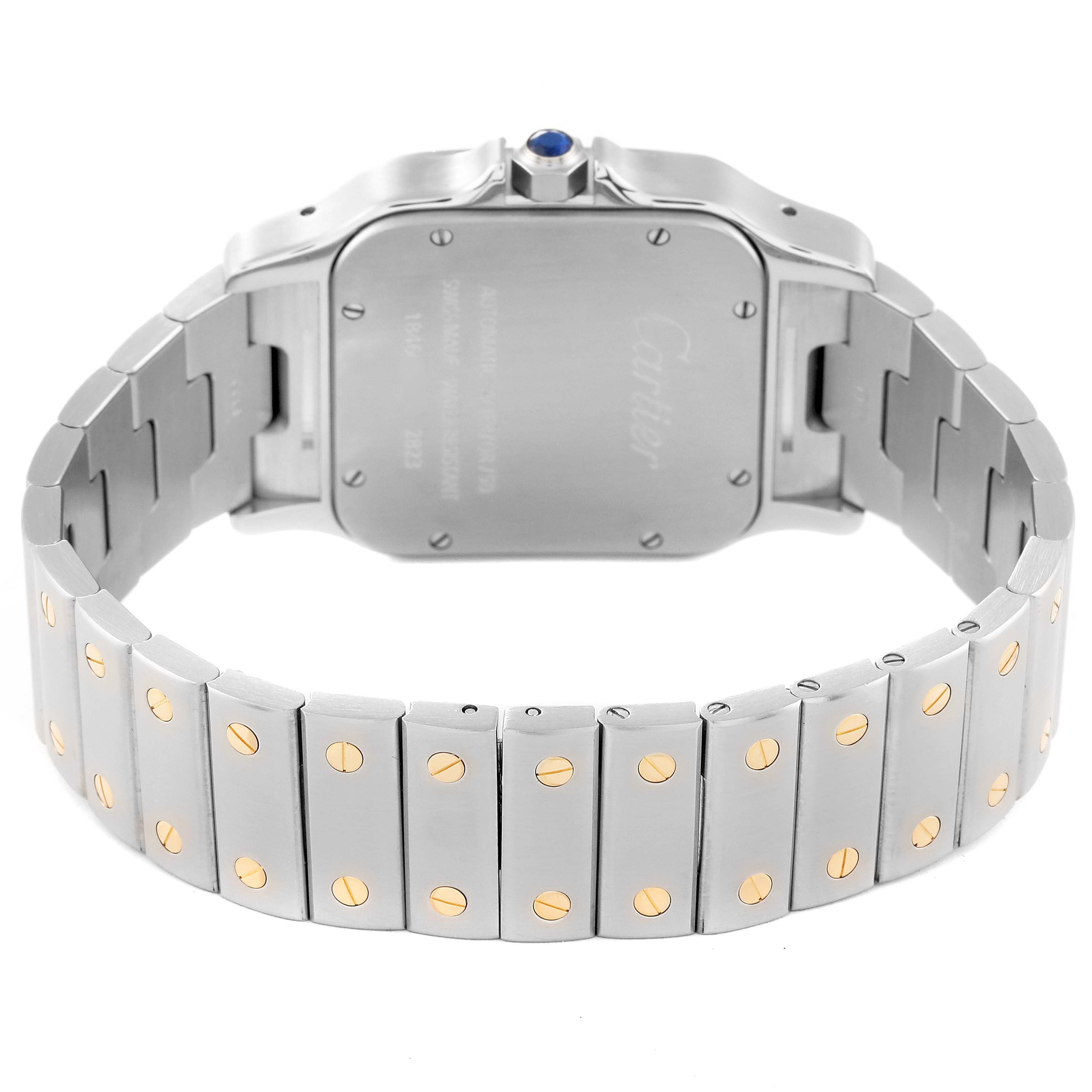The image shows the back and bracelet of a Santos model by Cartier, highlighting the screws on the stainless steel bracelet.