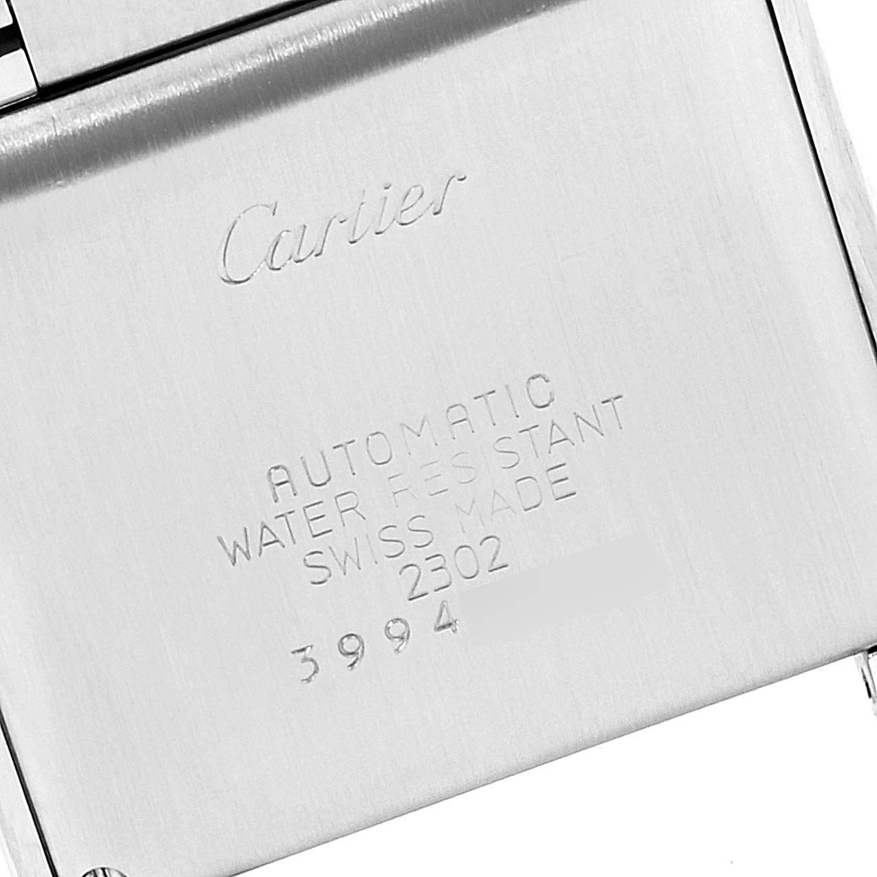 The image shows the back case of a Cartier Tank Francaise W51002Q3 Men's Stainless Steel Silver Dial W51002Q3 Men's Stainless Steel Silver Dial watch, displaying engraved details.
