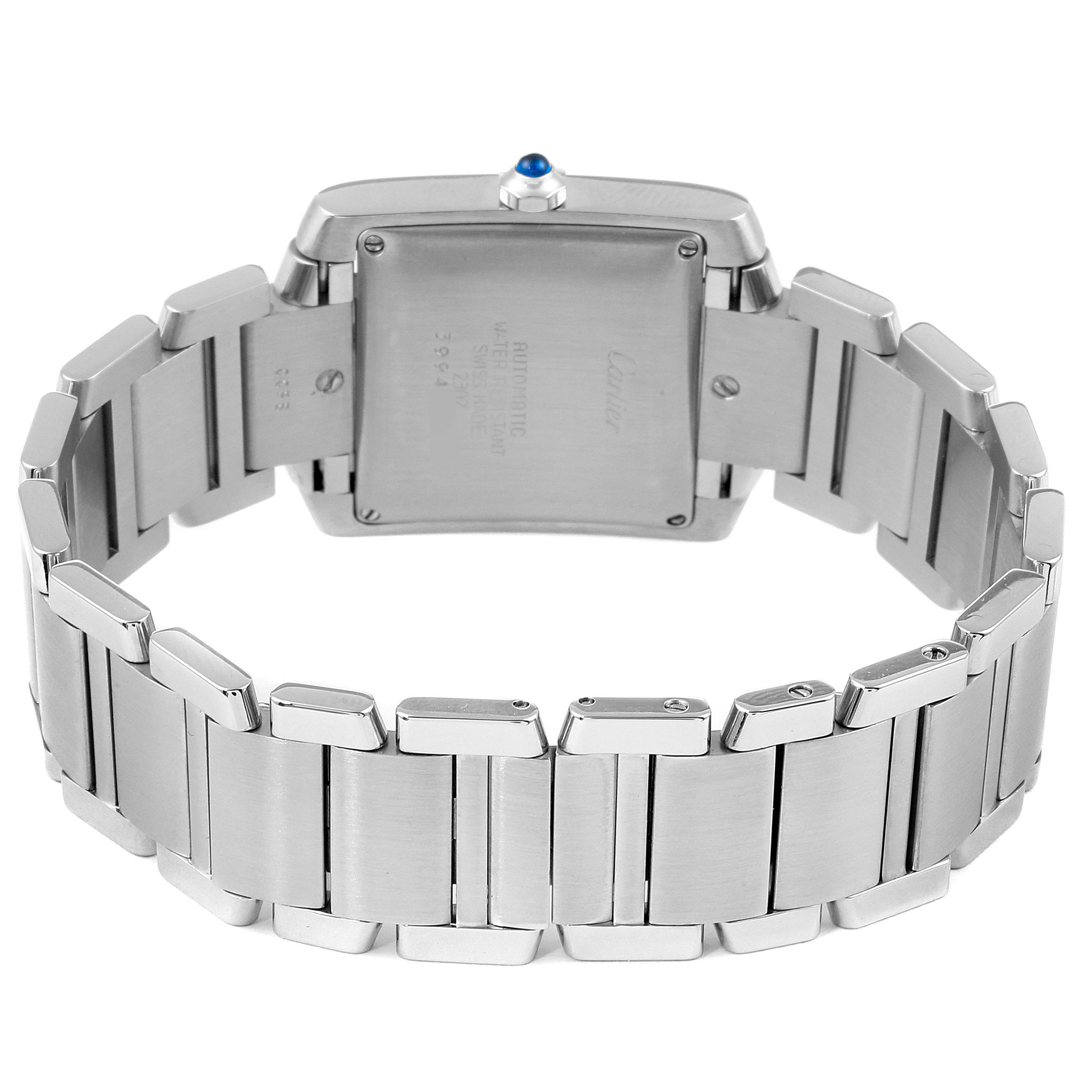 The image shows the Tank Francaise watch by Cartier from the back, highlighting the back case and stainless steel bracelet links.