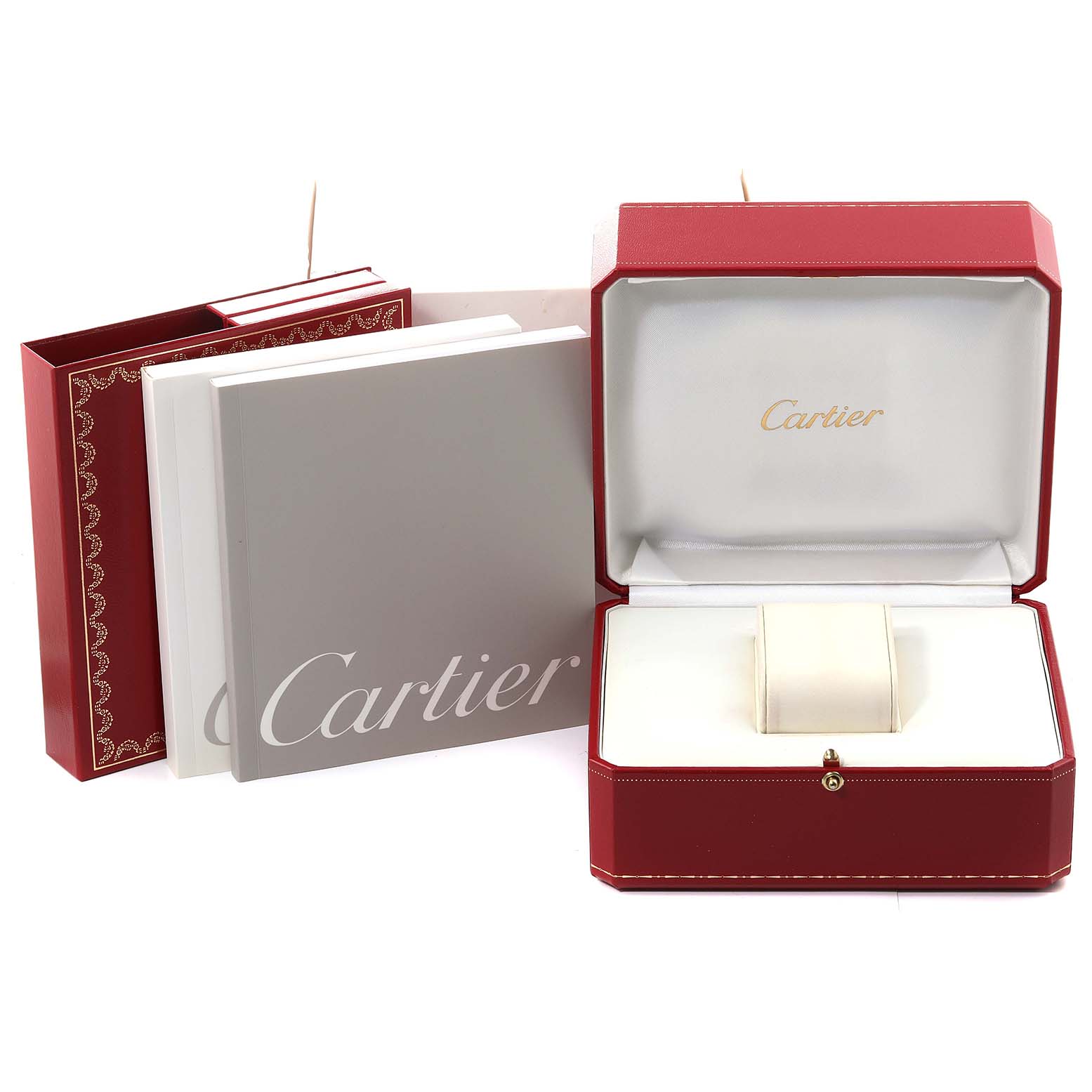 The image shows a Tank Francaise Cartier watch box, an open display box, and printed booklets from a front-facing angle.