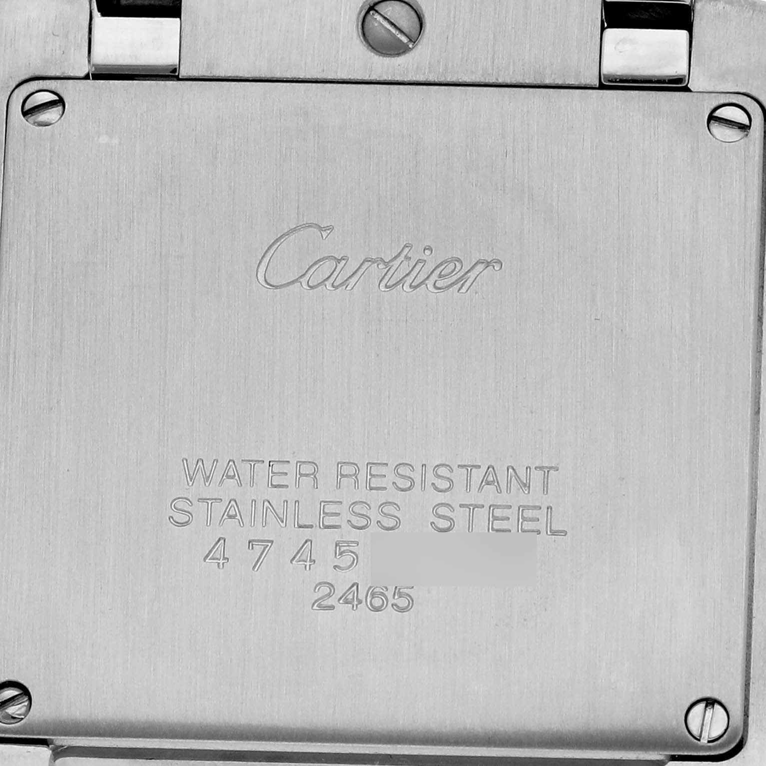 The image shows the back case of a Cartier Tank Française watch, highlighting the brand engraving and water resistance details.