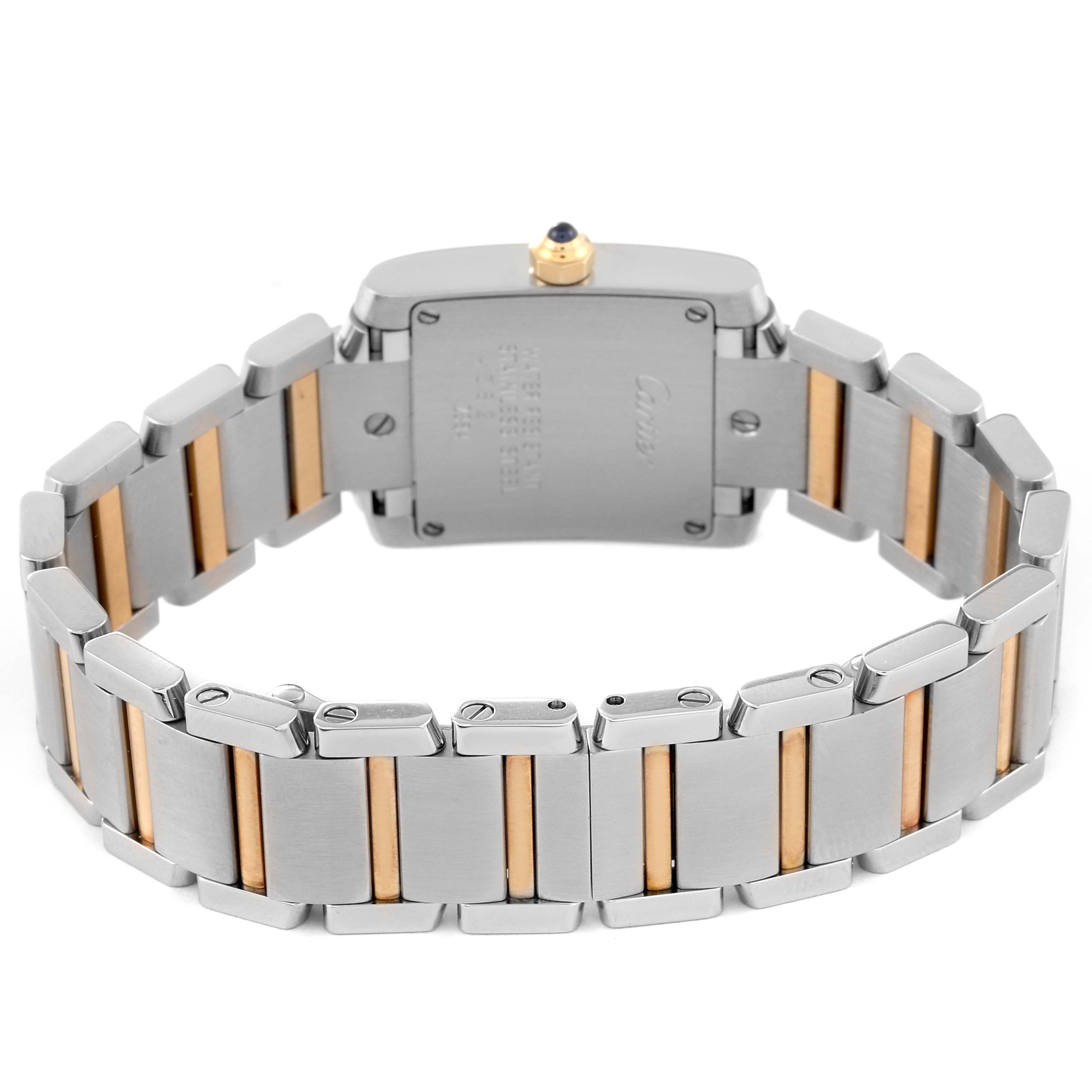 This image shows the back of the Cartier Tank Française watch, showcasing its two-tone metal bracelet and securing screws.