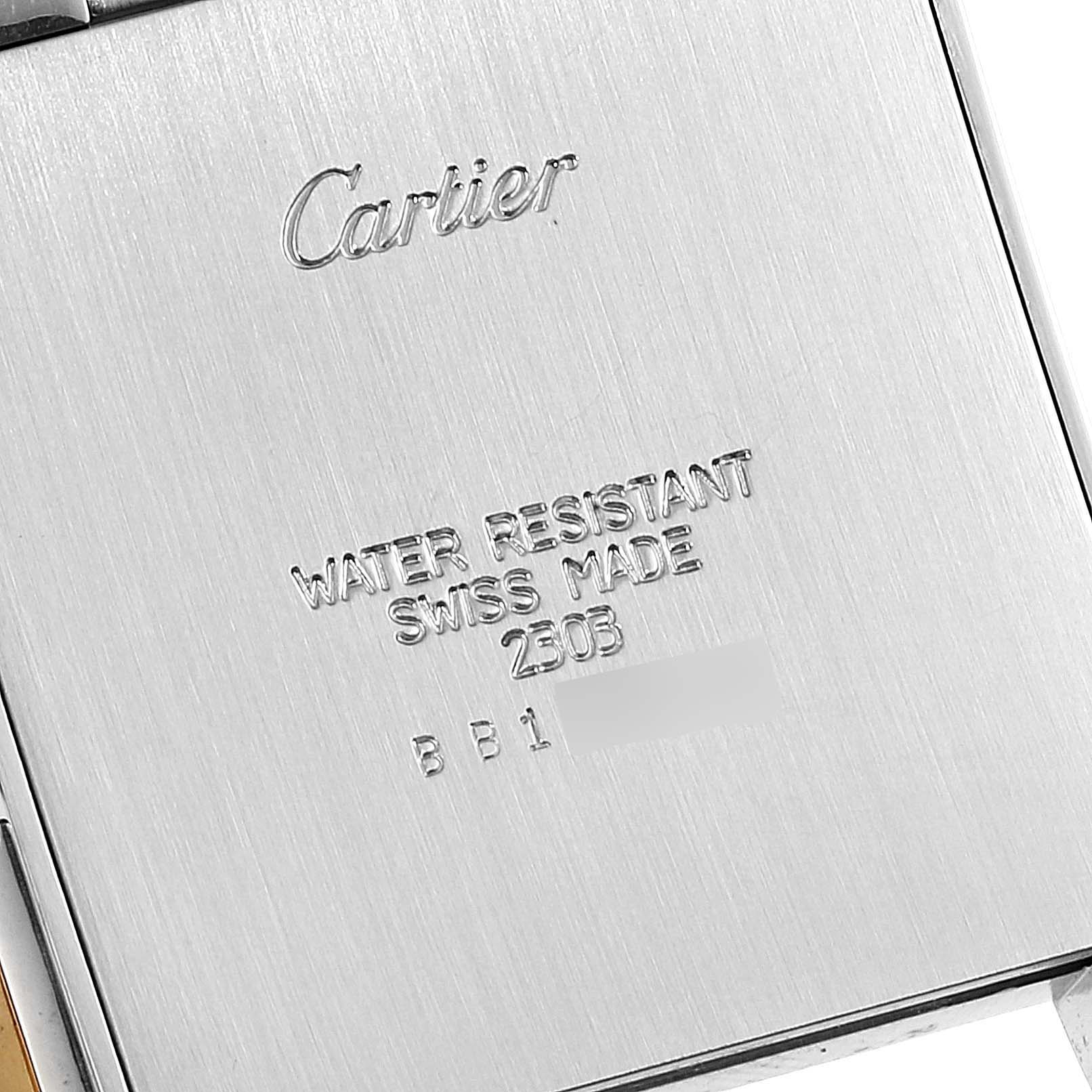 This image shows the back casing of a Cartier Tank Francaise W51004Q4 Men's Steel and Gold (two tone) Silver Dial W51004Q4 Men's Steel and Gold (two tone) Silver Dial watch, highlighting the brand name, water resistance, and Swiss-made details.