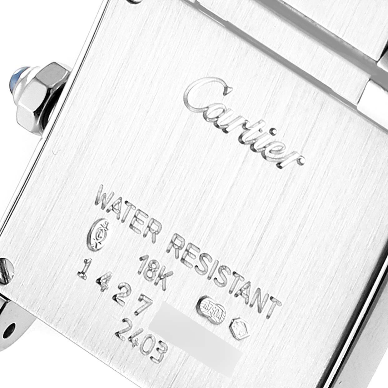 The image shows the backside of a Cartier Tank Francaise W50012S3 Women's White Gold Silver Dial W50012S3 Women's White Gold Silver Dial watch, highlighting its engravings and water resistance marking.