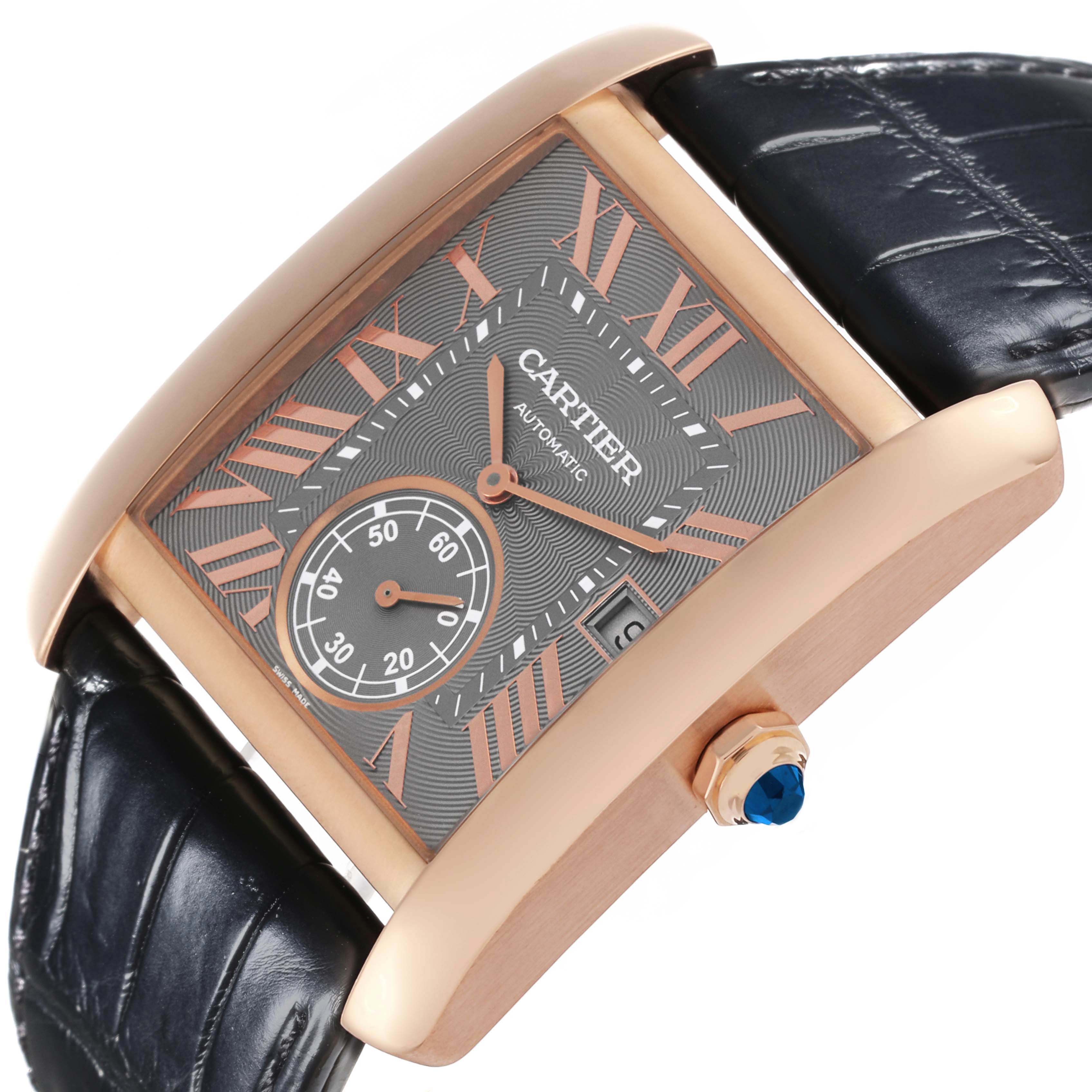 The Cartier Tank MC WGTA0014 Men's Rose Gold Grey Dial watch is shown angled, highlighting its rectangular face, crown, blue cabochon, and leather strap.