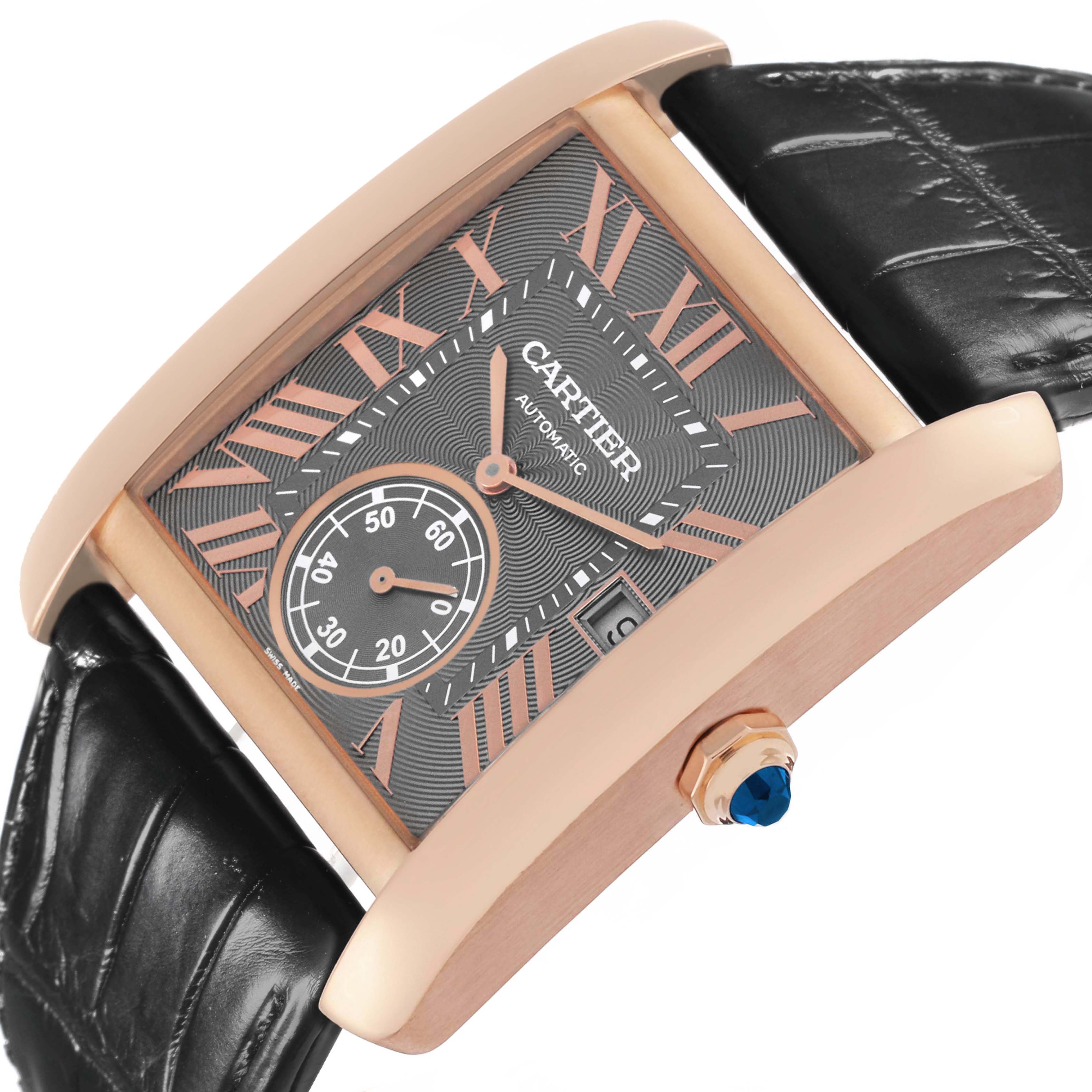 The Cartier Tank MC WGTA0014 Mens Rose Gold Grey Dial watch is shown at an angle, highlighting its rectangular case, dial, crown, and black strap.