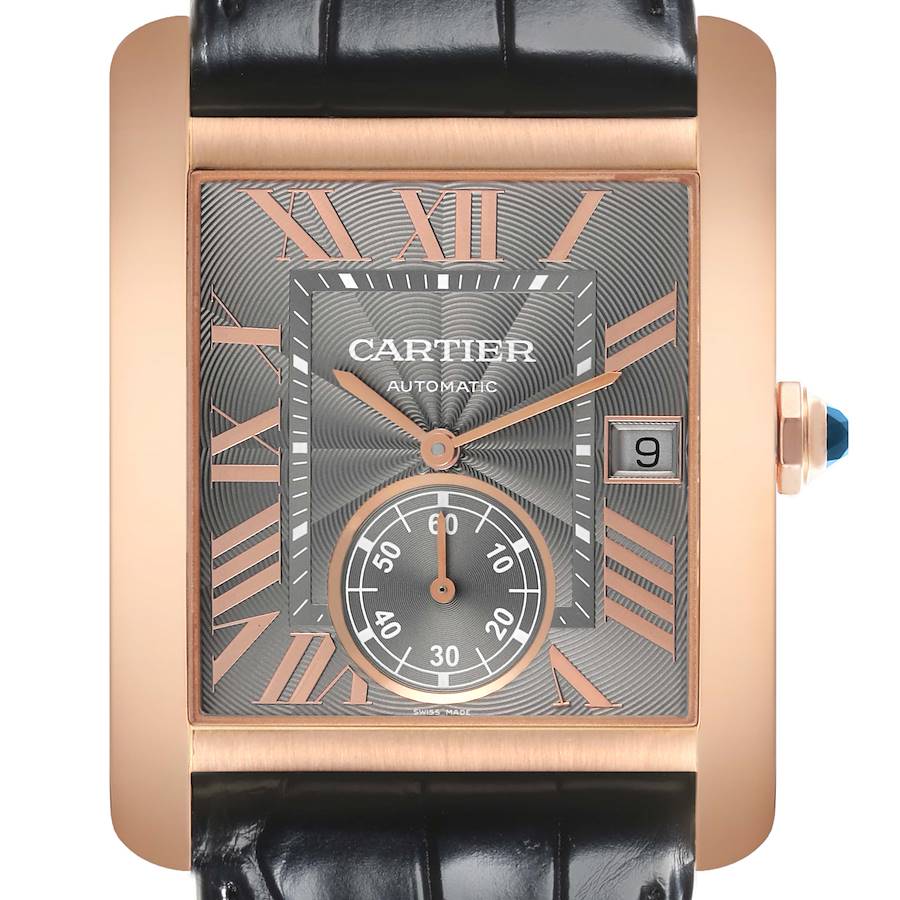 The Cartier Tank MC watch is shown from a top-down angle, displaying the face and Roman numeral markers with a visible date window.