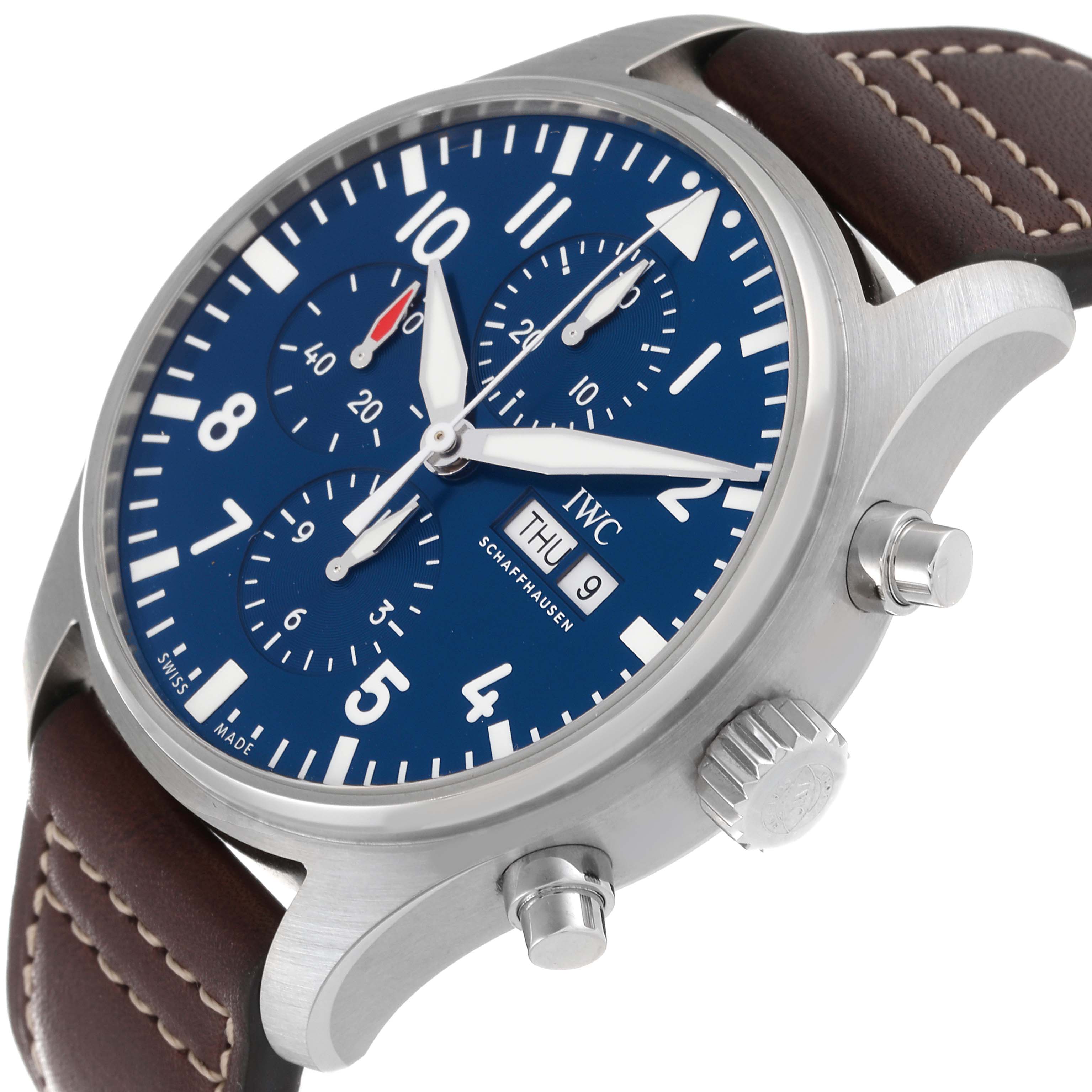 The IWC Pilot IW377714 Men's Stainless Steel Blue Dial IW377714 Men's Stainless Steel Blue Dial model watch is shown at a three-quarter angle, displaying the face, bezel, crown, pushers, and part of the leather strap.