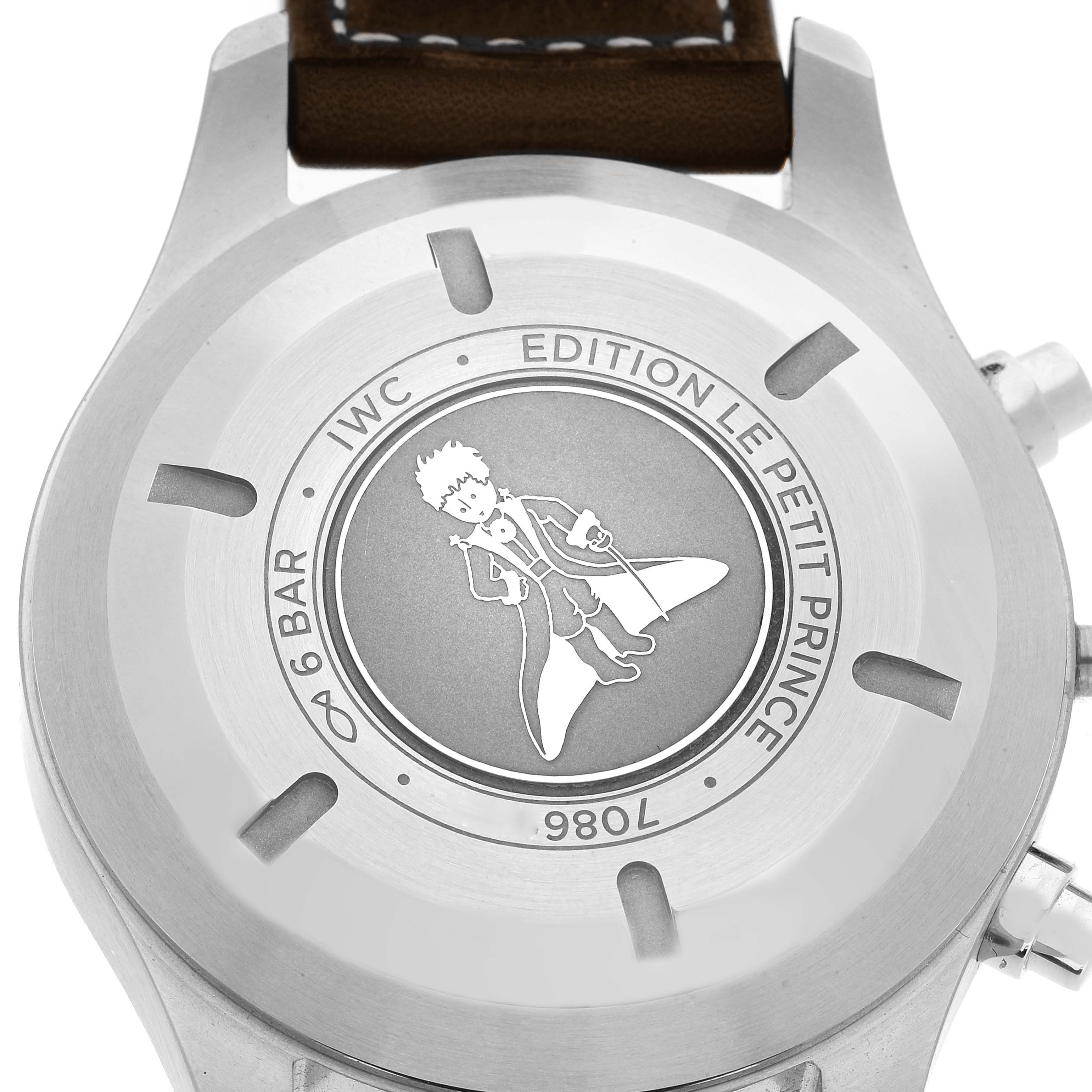 The image shows the case back of an IWC Pilot IW377714 Men's Stainless Steel Blue Dial IW377714 Men's Stainless Steel Blue Dial model watch from a top-down view, showcasing "Le Petit Prince" engraving.