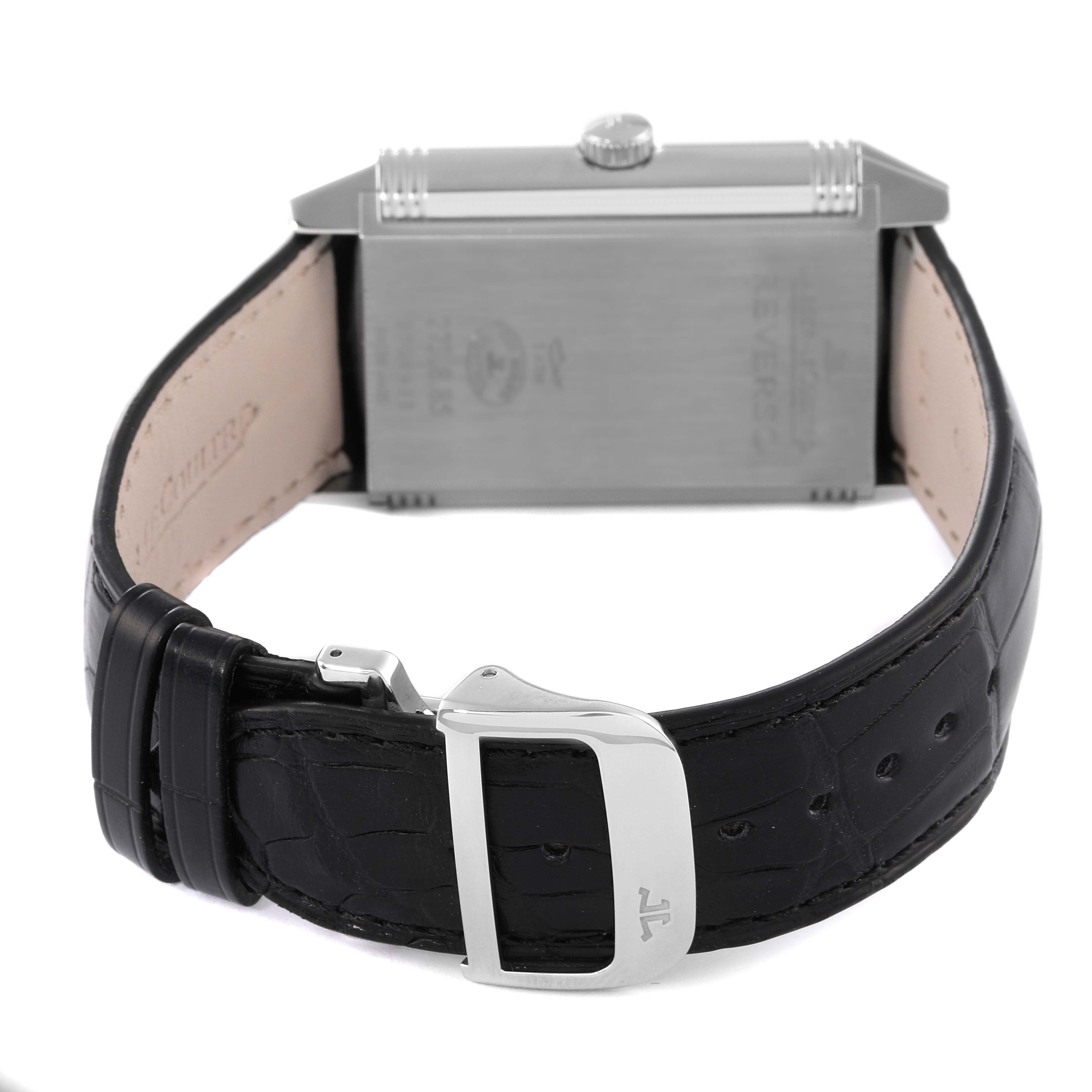 This image shows the back view of a Jaeger-LeCoultre Reverso watch, featuring its leather strap and stainless steel clasp.