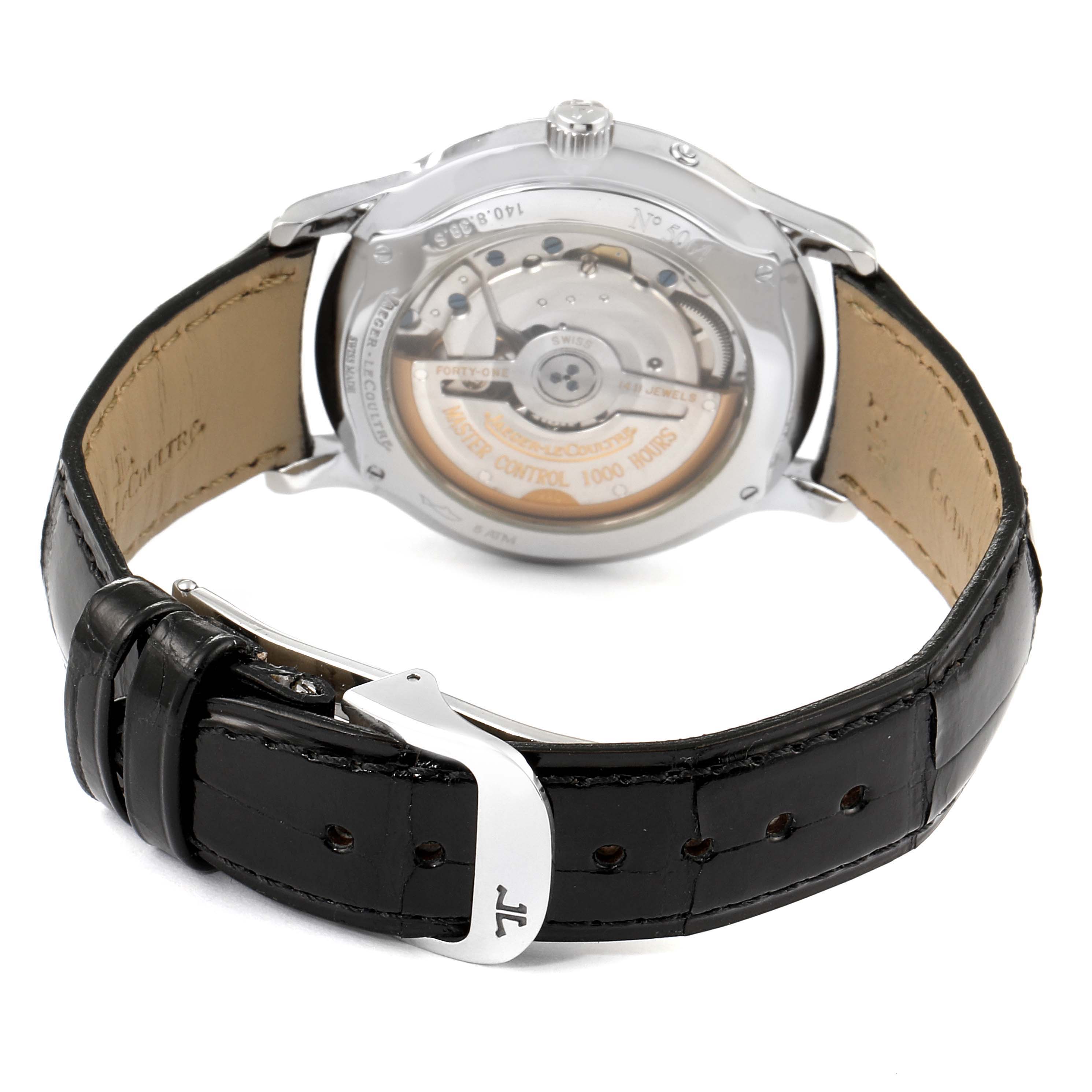 The image shows the backside of a Jaeger LeCoultre Master Q1488404 Men's Stainless Steel Silver Dial Q1488404 Men's Stainless Steel Silver Dial model watch, showcasing its movement and black leather strap with a silver buckle.