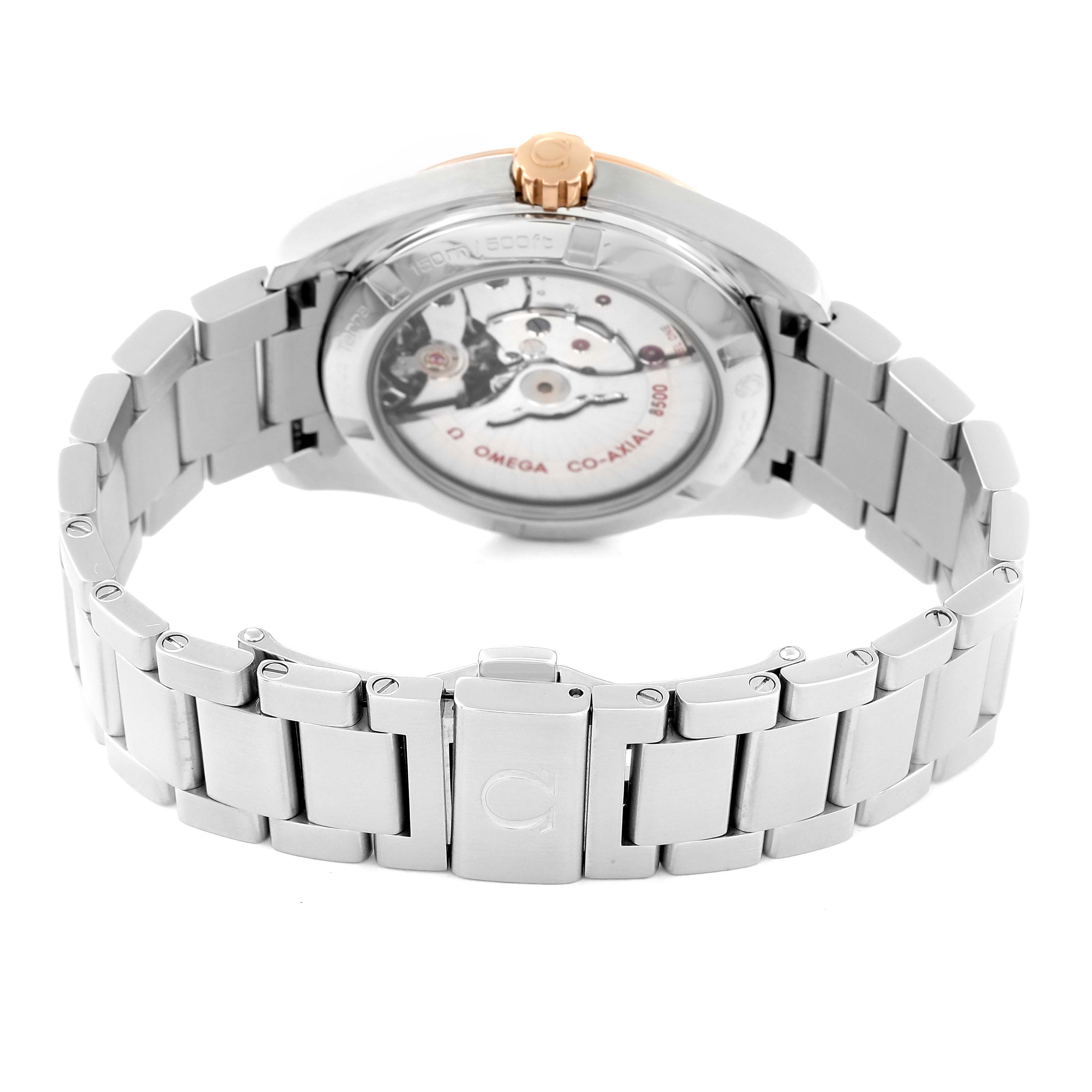 The image shows the back and clasp of the Omega Aqua Terra 231.20.39.21.51.003 Men's Steel and Gold (two tone) Black Dial 231.20.39.21.51.003 Men's Steel and Gold (two tone) Black Dial watch, highlighting its metal bracelet and exposed mechanical movement.