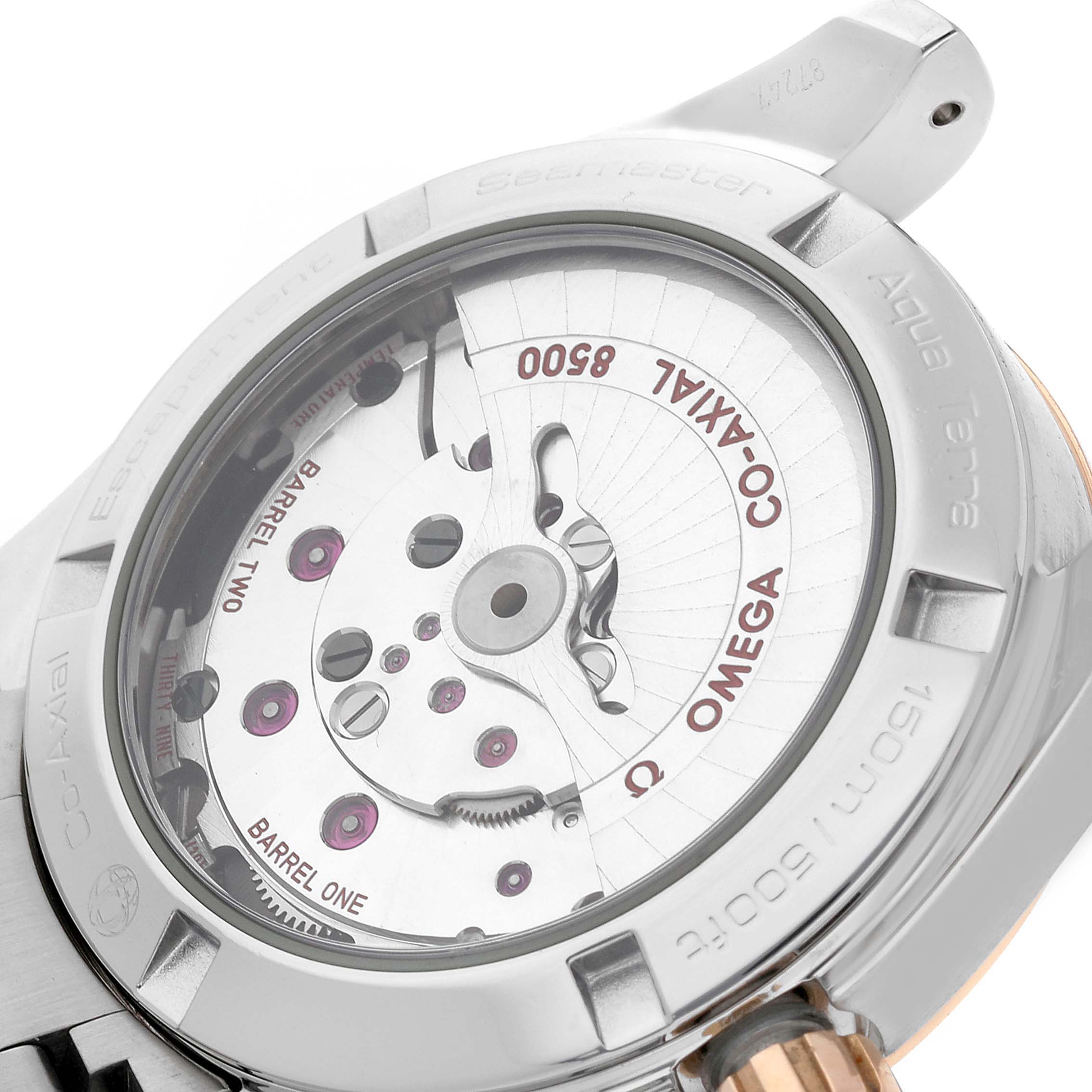 The image shows the back view of the Omega Aqua Terra 231.20.39.21.51.003 Men's Steel and Gold (two tone) Black Dial 231.20.39.21.51.003 Men's Steel and Gold (two tone) Black Dial watch, featuring its visible movement and engravings.