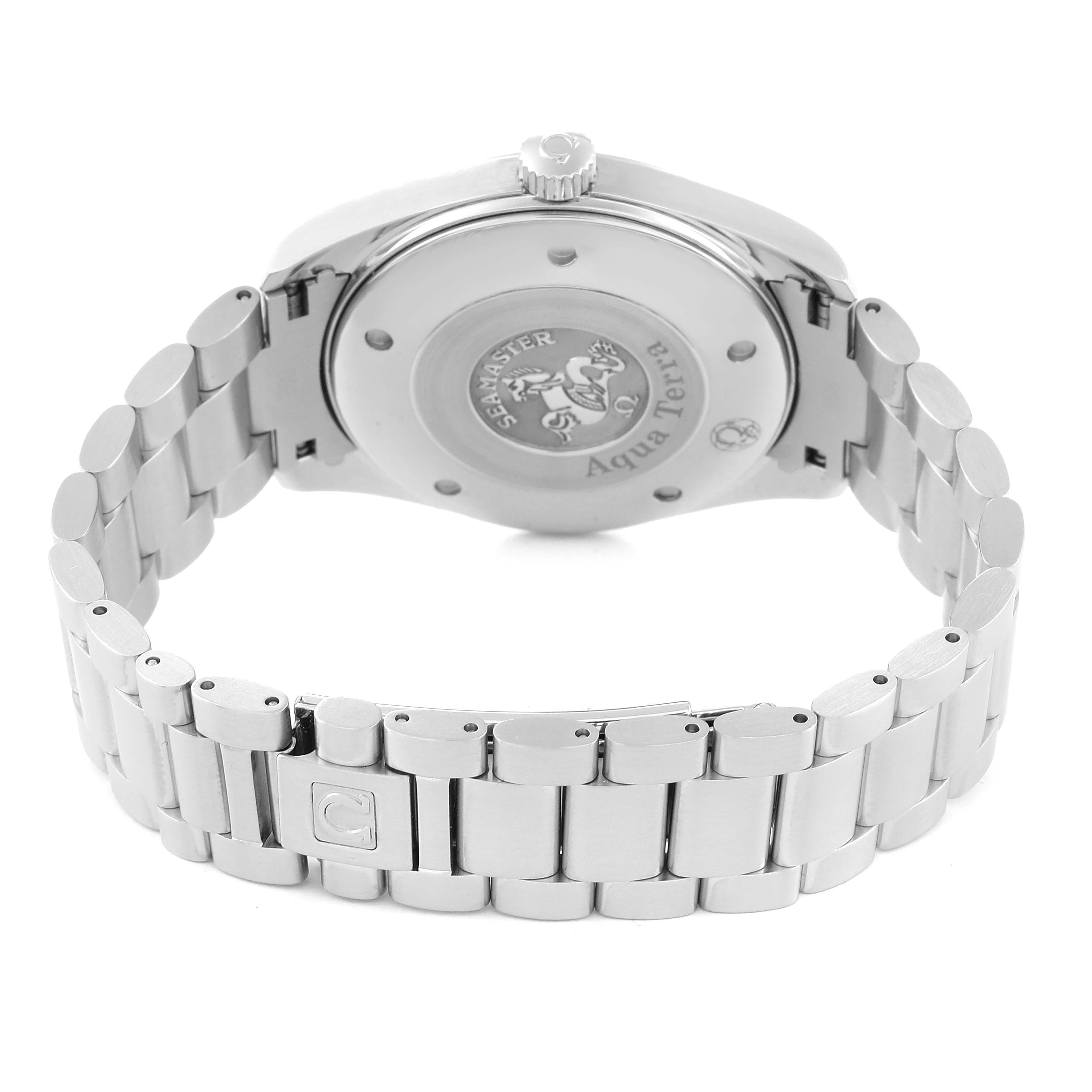 The image shows the back case and bracelet of an Omega Aqua Terra 2517.50.00 Men's Stainless Steel Black Dial 2517.50.00 Men's Stainless Steel Black Dial watch, highlighting the engraved case back and metal bracelet.