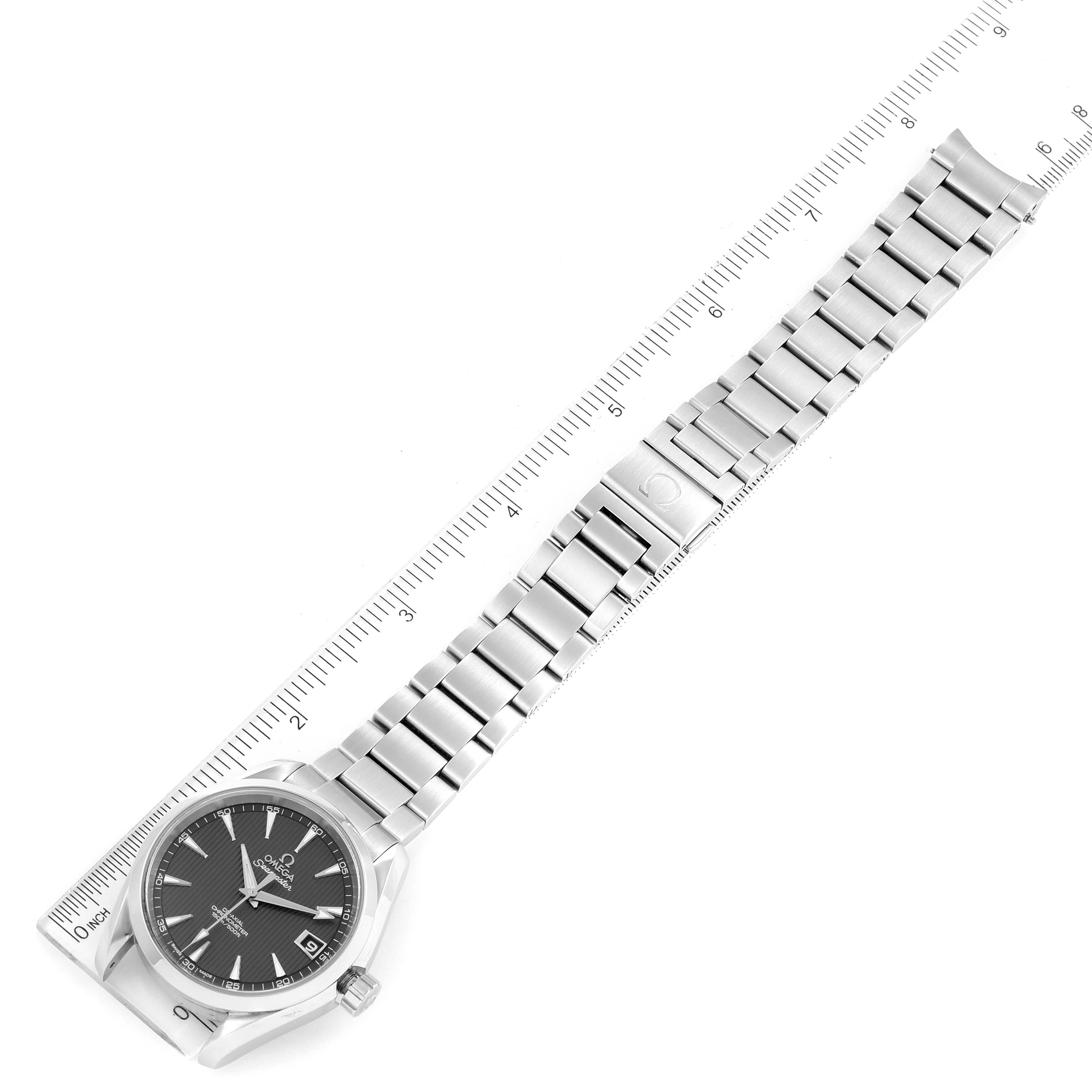 The image shows a full view of an Omega Aqua Terra 231.10.39.21.06.001 Men
s Stainless Steel Grey Dial 231.10.39.21.06.001 Men
s Stainless Steel Grey Dial watch, including the face and stainless steel bracelet, alongside a ruler for scale.
