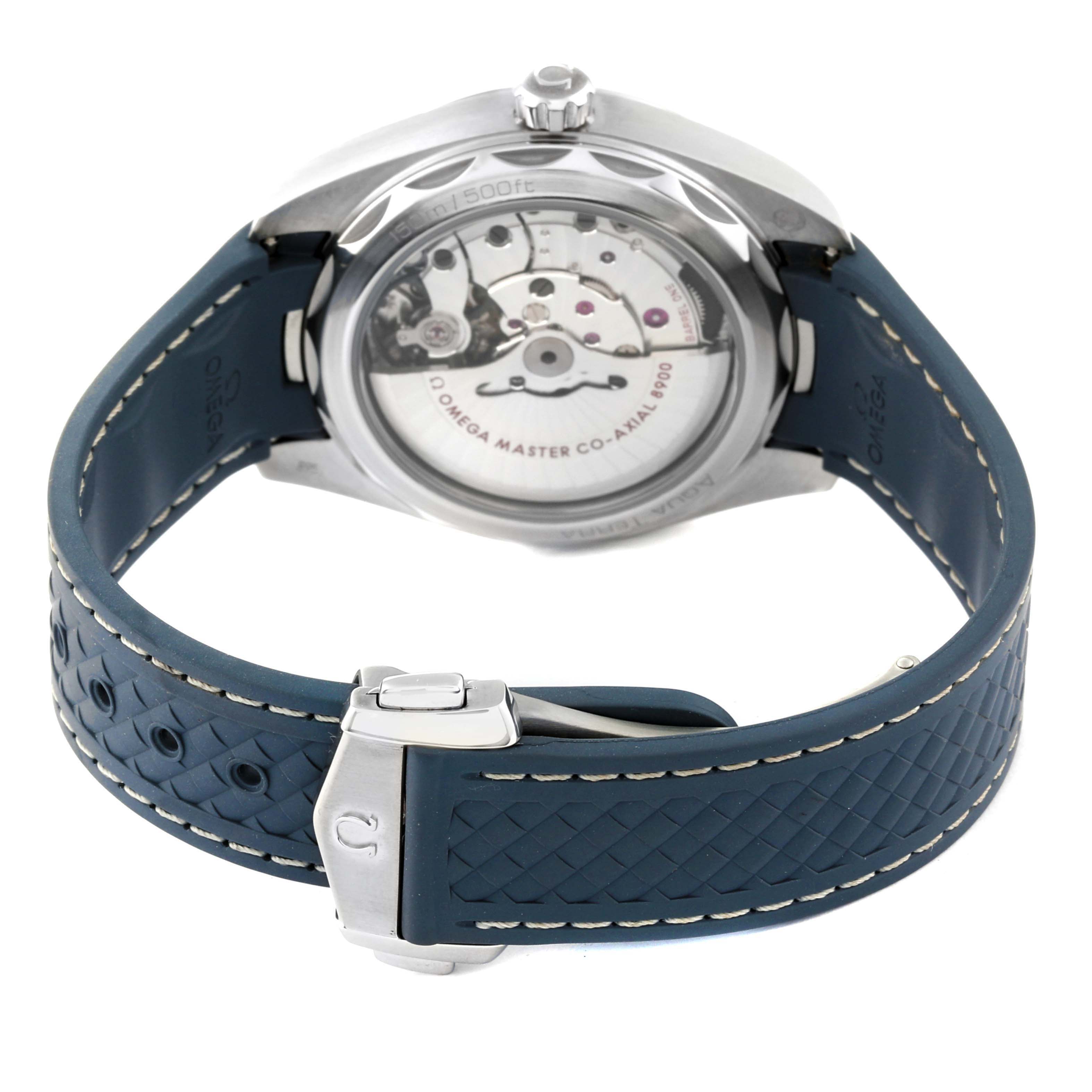 The image shows the back view of the Omega Aqua Terra 220.12.41.21.03.002 Men
s Stainless Steel Blue Dial 220.12.41.21.03.002 Men
s Stainless Steel Blue Dial watch, highlighting its movement and a blue rubber strap with a clasp.