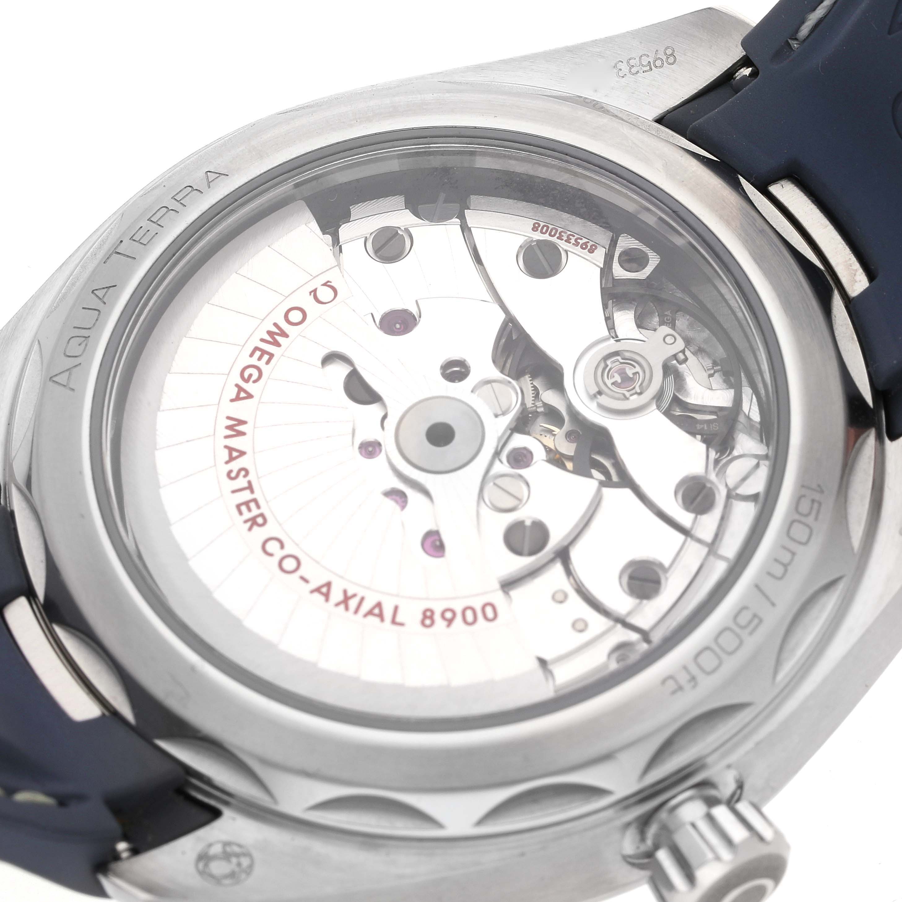 The image shows the back case and movement details of an Omega Aqua Terra 220.12.41.21.03.002 Men
s Stainless Steel Blue Dial 220.12.41.21.03.002 Men
s Stainless Steel Blue Dial watch, highlighting the Omega Master Co-Axial 8900 mechanism.