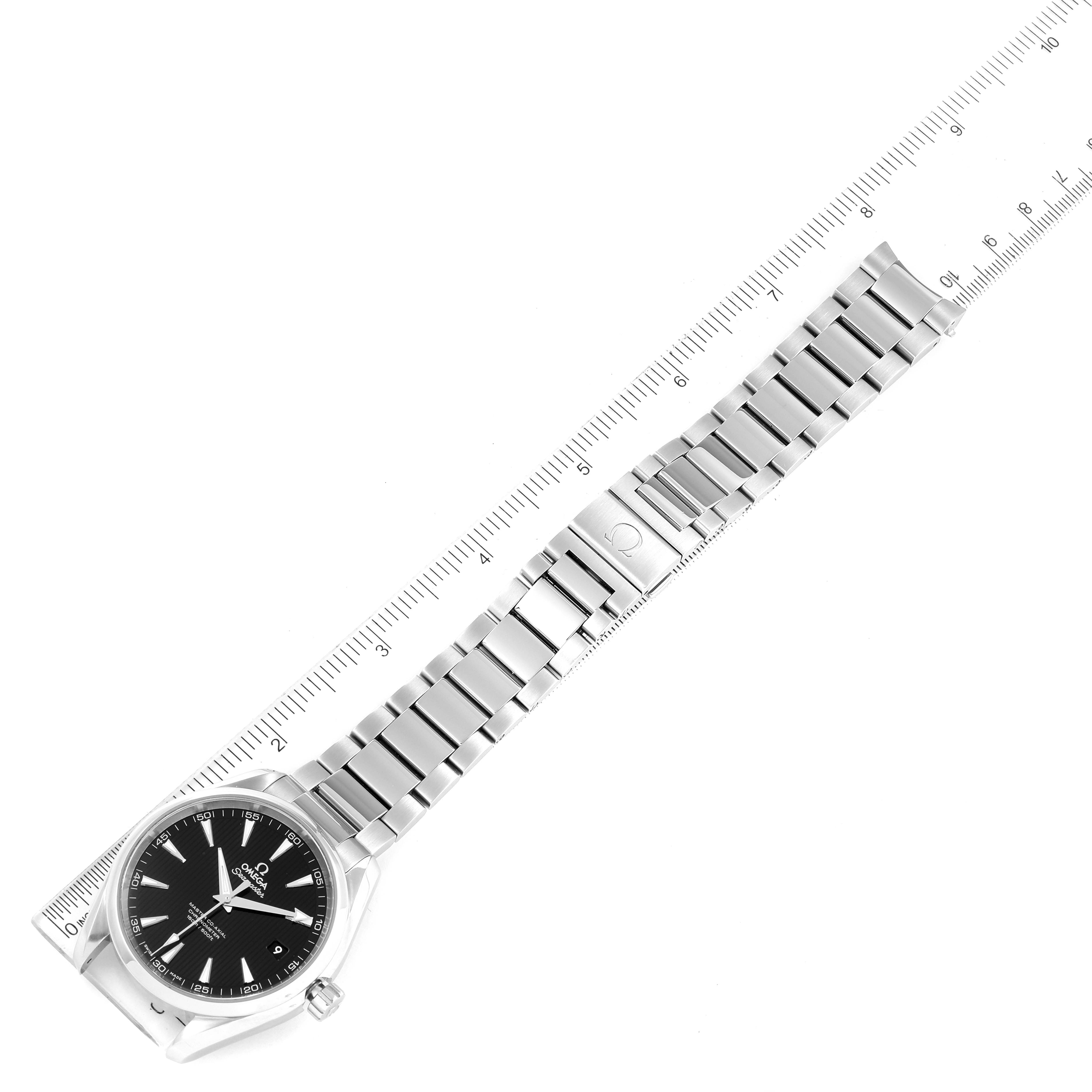 The image shows an overhead view of an Omega Aqua Terra 231.10.42.21.01.003 Men's Stainless Steel Black Dial 231.10.42.21.01.003 Men's Stainless Steel Black Dial watch, displaying the full face and metal bracelet alongside a ruler for scale.