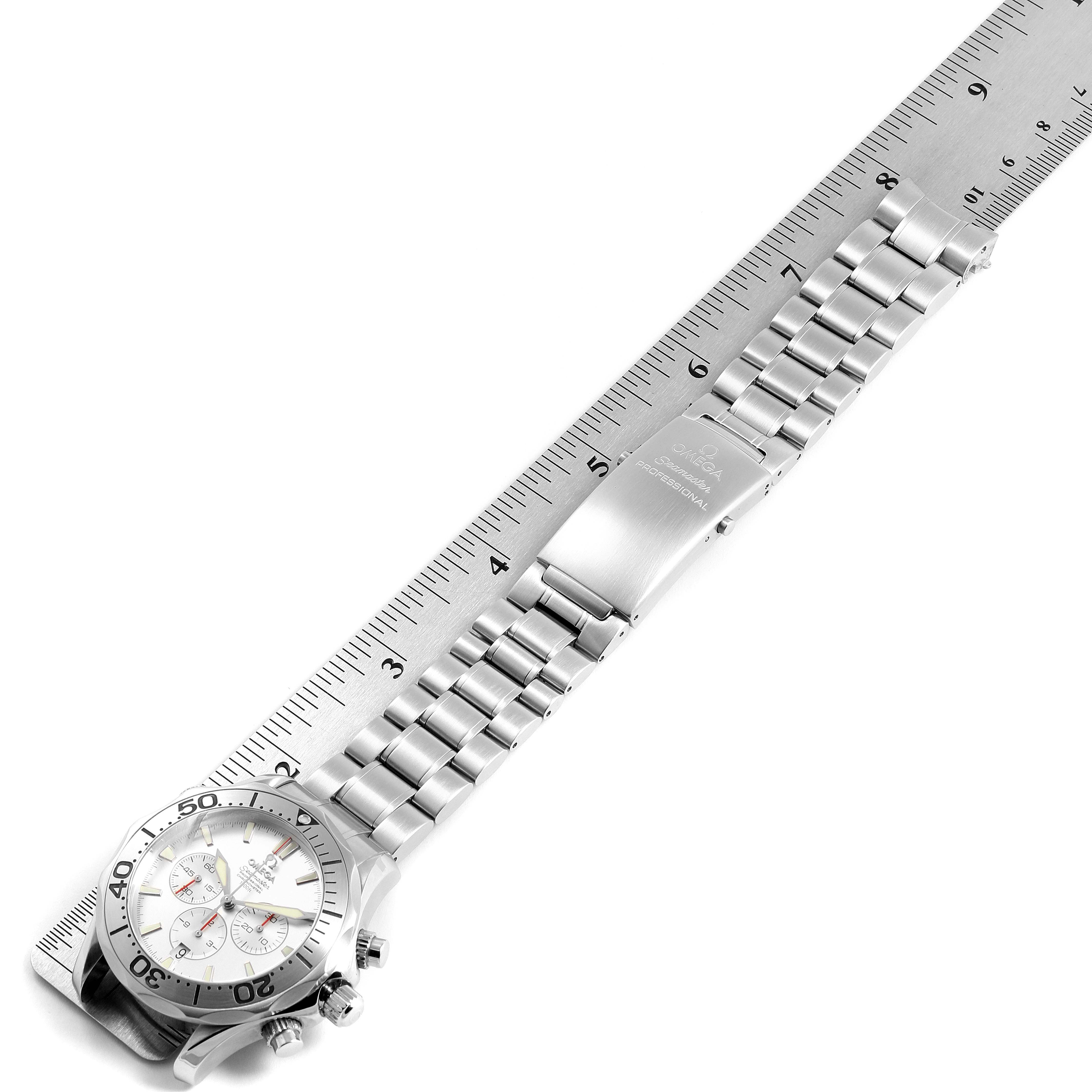 The image shows an Omega Seamaster 2589.30.00 Men
s Stainless Steel Silver Dial 2589.30.00 Men
s Stainless Steel Silver Dial watch placed next to a ruler, displaying its bracelet, clasp, and part of the watch face at a top-down angle.