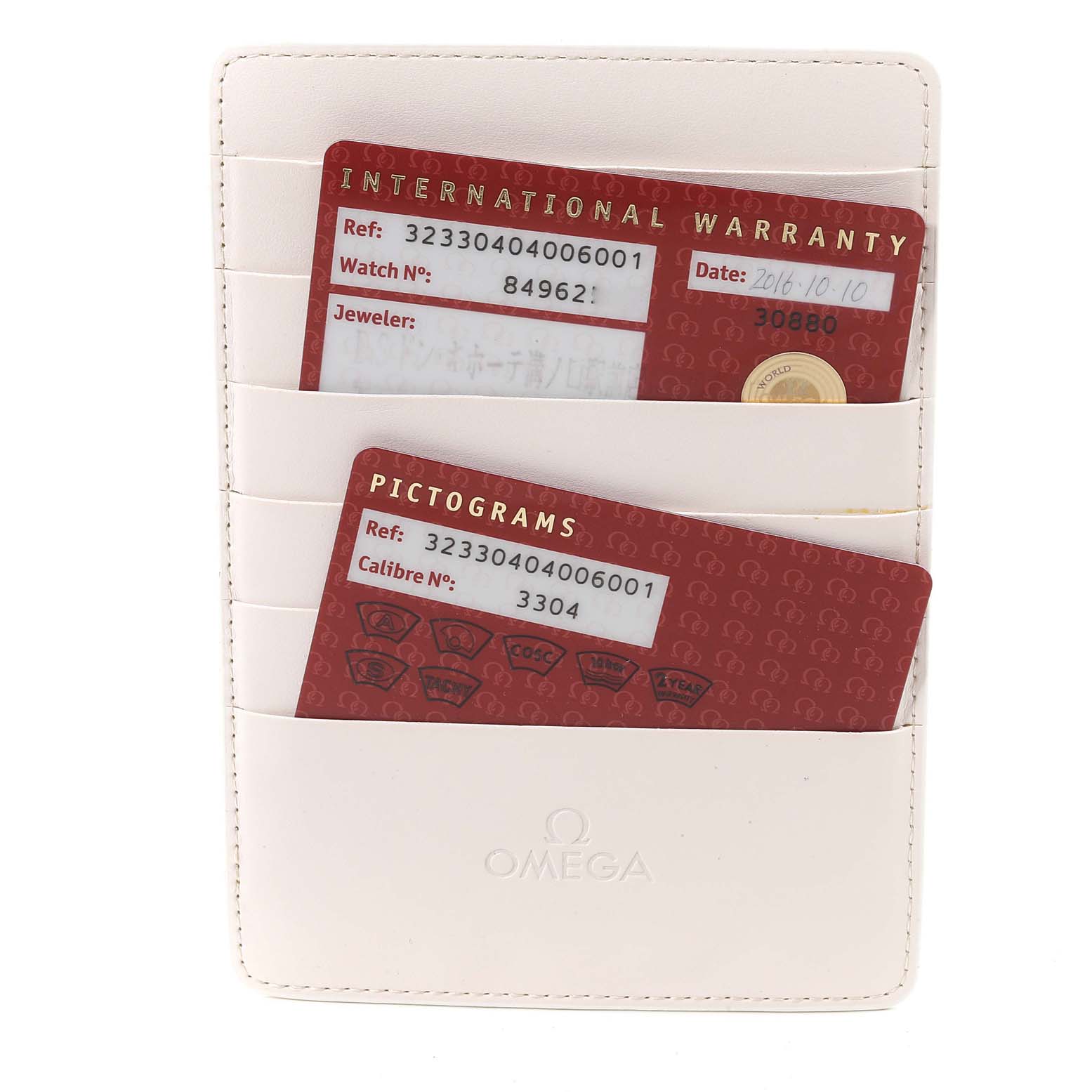 The image shows the international warranty and pictogram cards for an Omega Speedmaster 323.30.40.40.06.001 Men's Stainless Steel Grey Dial 323.30.40.40.06.001 Men's Stainless Steel Grey Dial watch, inside a white cardholder.