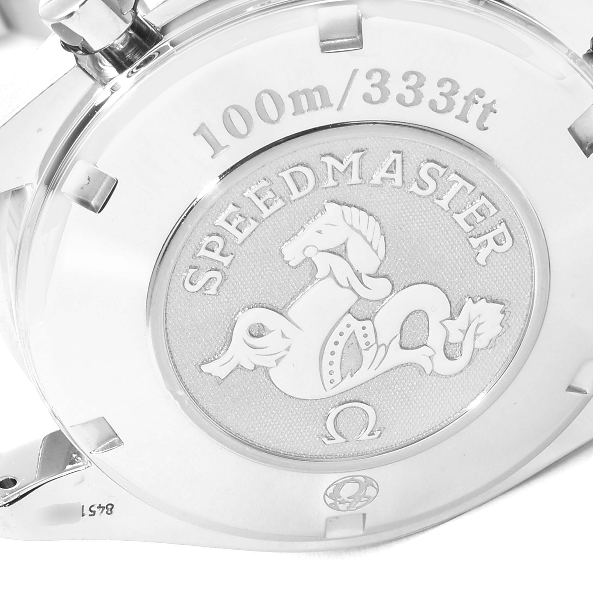 The image shows the engraved case back of an Omega Speedmaster 3211.31.00 Men
s Stainless Steel Silver Dial 3211.31.00 Men
s Stainless Steel Silver Dial watch from a close-up angle.
