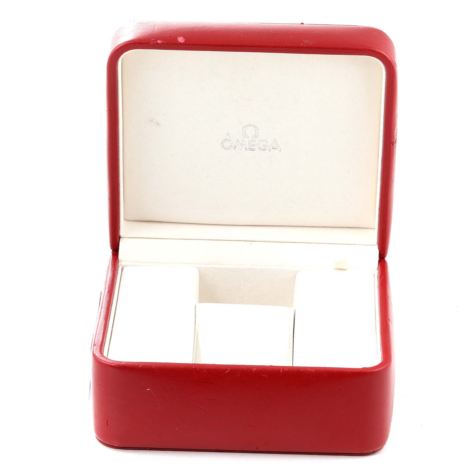 This image shows an opened red Omega watch box, likely for the Speedmaster model, with padded interior compartments.
