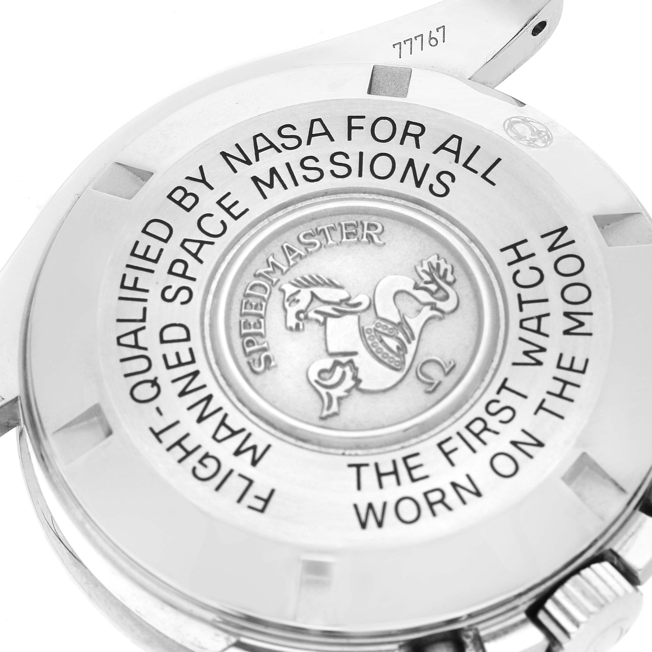 The image shows the case back of the Omega Speedmaster 3570.50.00 Men's Stainless Steel Black Dial 3570.50.00 Men's Stainless Steel Black Dial watch, highlighting its engraved text and logo.