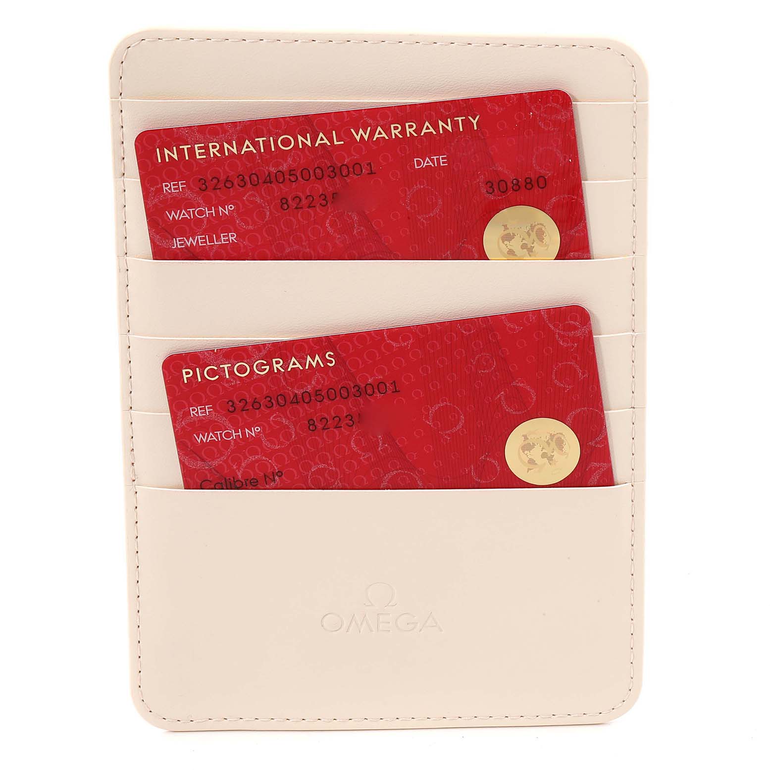 The image shows warranty and pictograms cards in a beige Omega Speedmaster 326.30.40.50.03.001 Men
s Stainless Steel Blue Dial 326.30.40.50.03.001 Men
s Stainless Steel Blue Dial holder, viewed from the front.