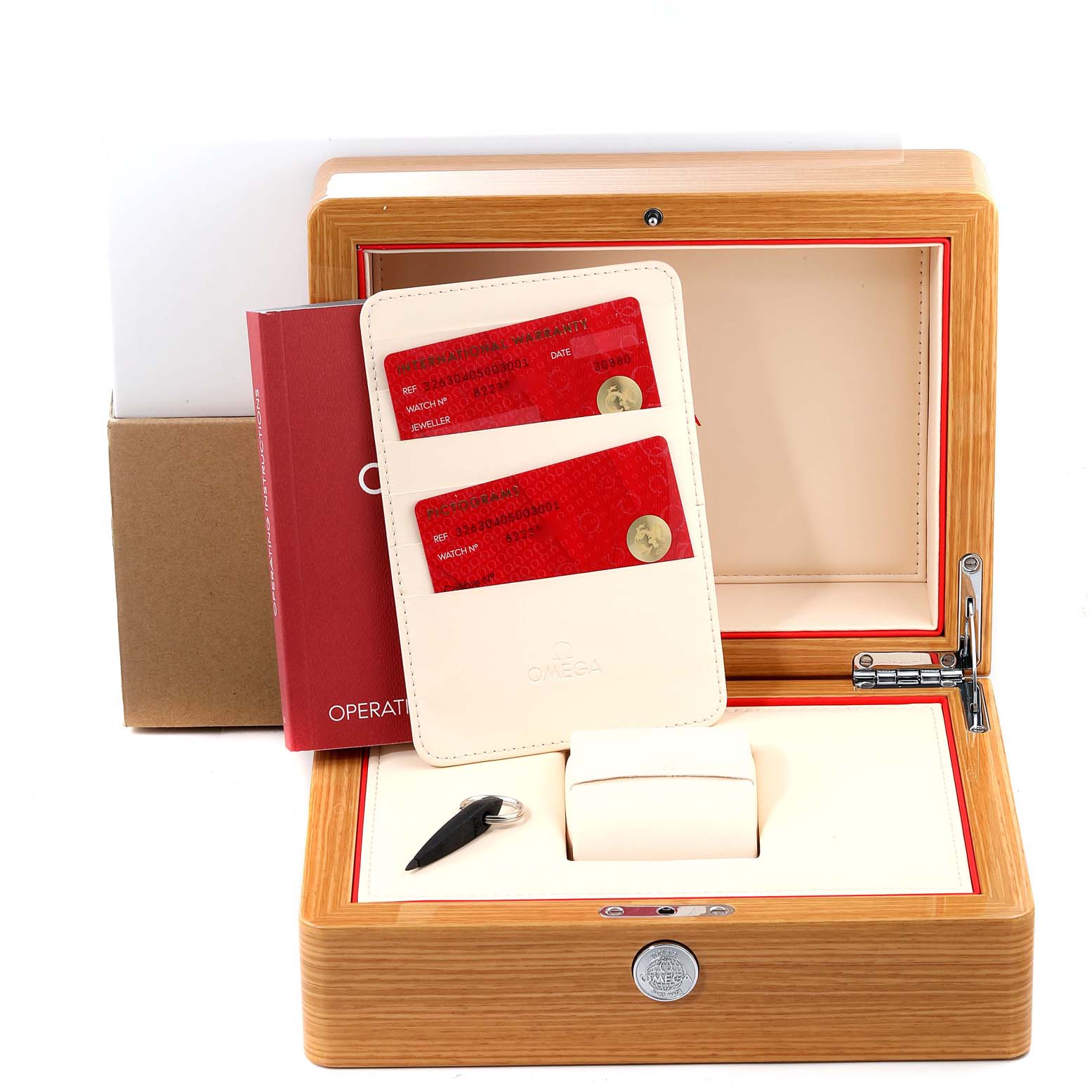 The image shows the packaging and accessories for an Omega Speedmaster 326.30.40.50.03.001 Men
s Stainless Steel Blue Dial 326.30.40.50.03.001 Men
s Stainless Steel Blue Dial, including the box, warranty cards, cardholder, and an operation manual.