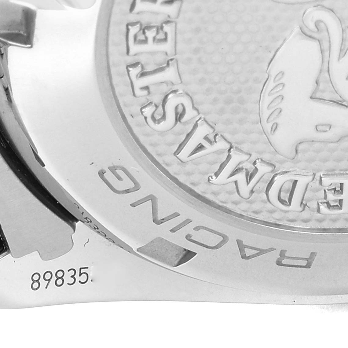 The image shows a close-up of the back case of an Omega Speedmaster 326.30.40.50.01.002 Men's Stainless Steel Black Dial 326.30.40.50.01.002 Men's Stainless Steel Black Dial watch, displaying part of the model name and serial number.