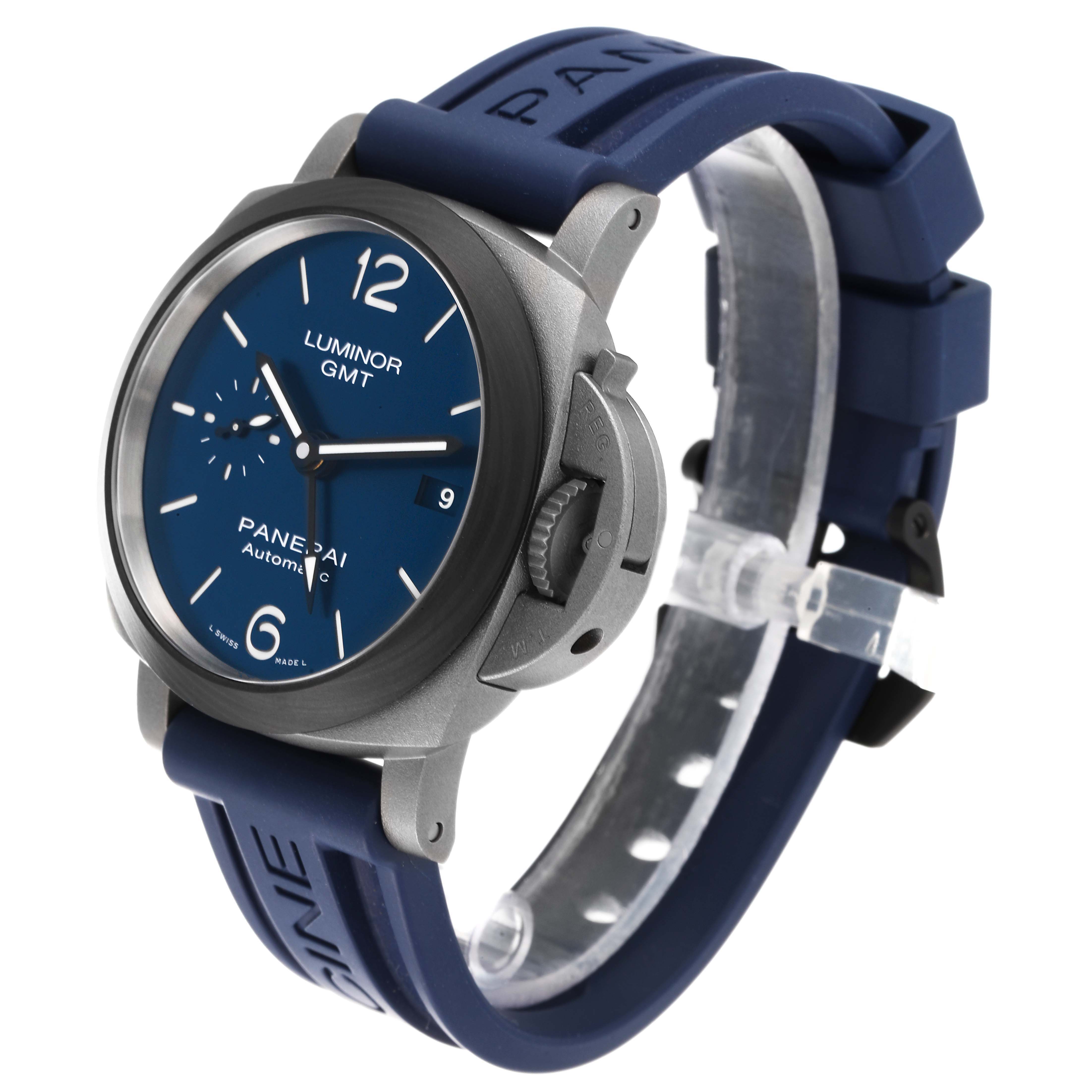 This Panerai Luminor PAM01279 Men's Titanium Blue Dial PAM01279 Men's Titanium Blue Dial GMT watch is shown at an angle displaying the face, bezel, crown guard, and blue rubber strap.