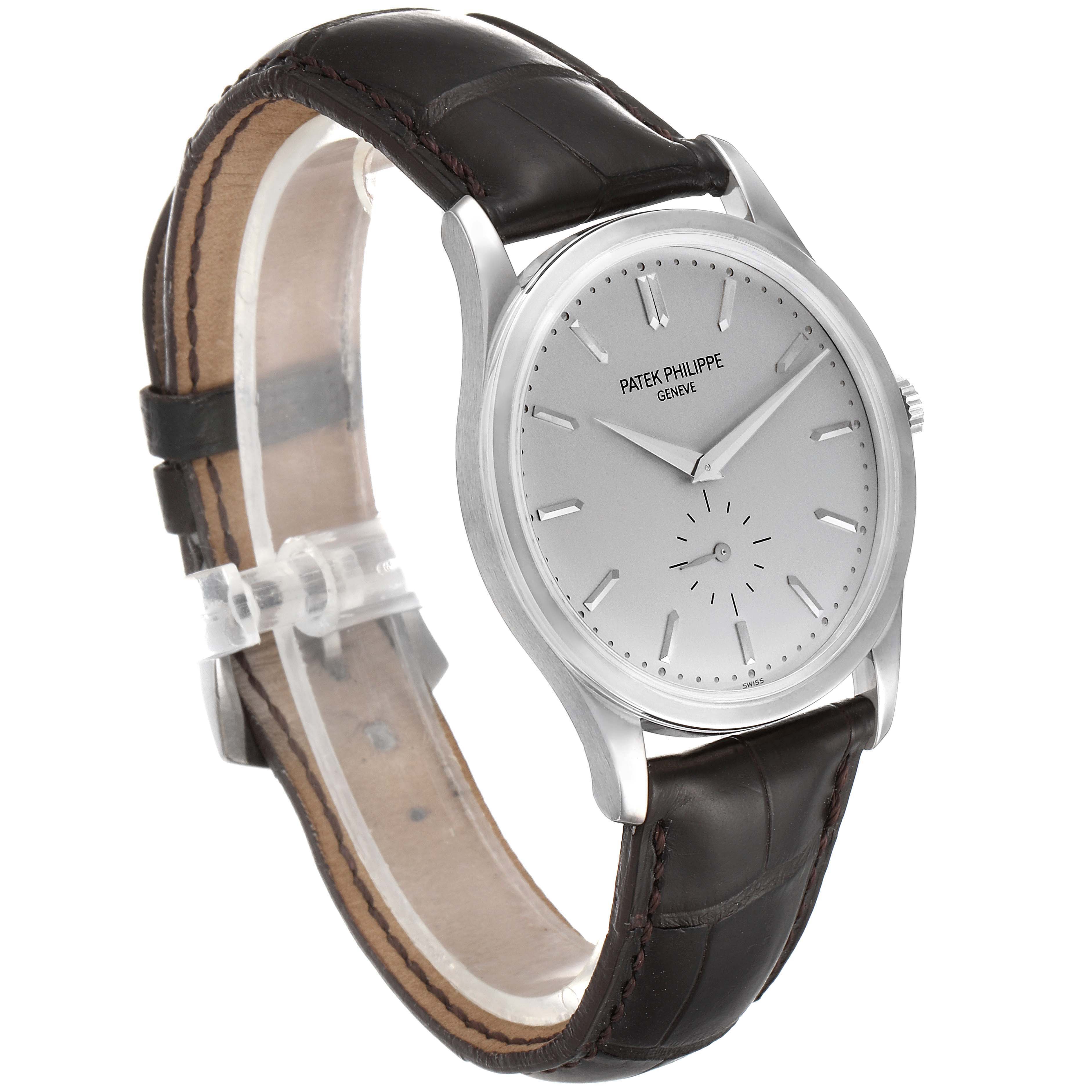 The image shows a Patek Philippe Calatrava 5196G Men's White Gold Silver Dial 5196G Men's White Gold Silver Dial watch at a front-left angle, displaying its dial, case, and leather strap.