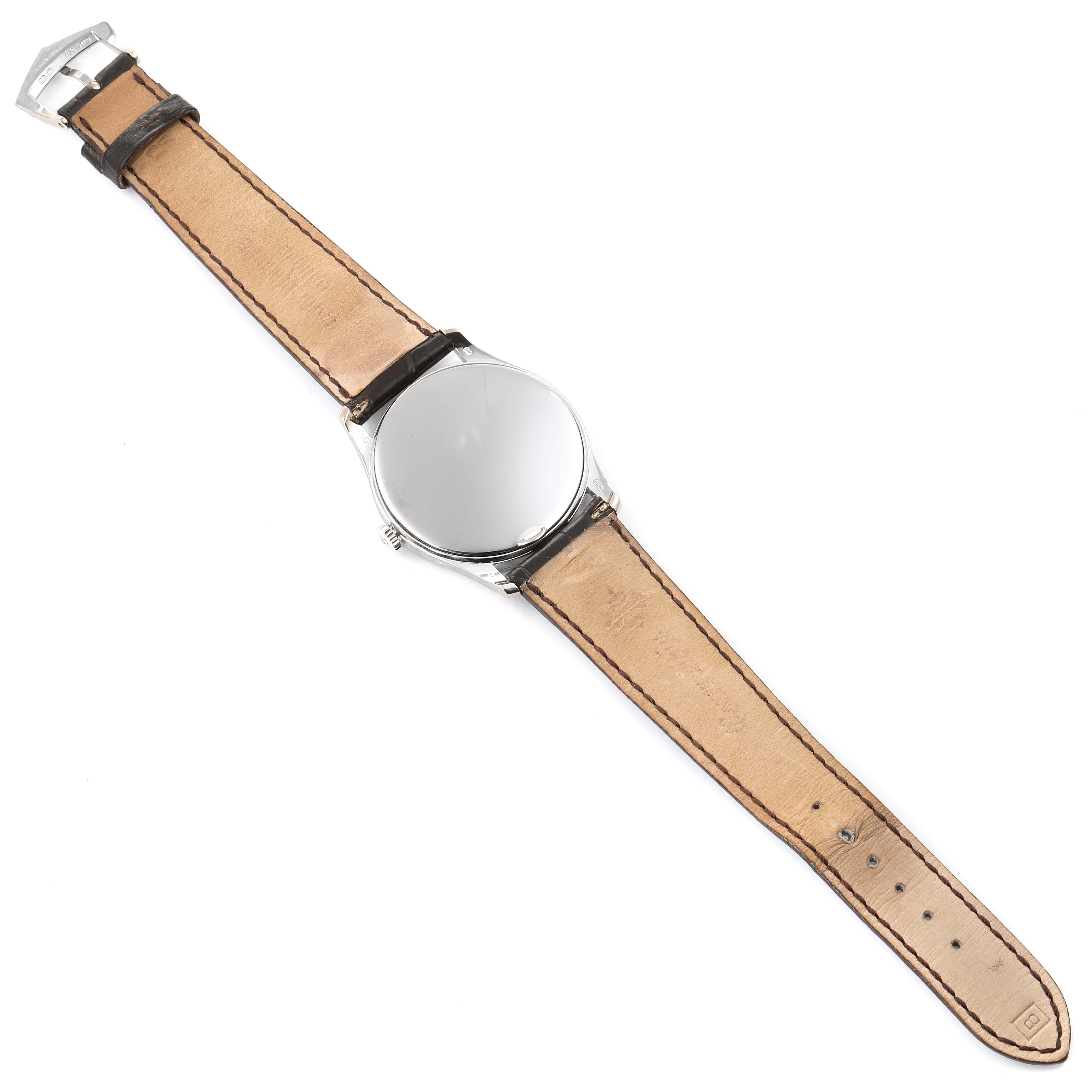 This image shows the back and leather strap of a Patek Philippe Calatrava 5196G Men's White Gold Silver Dial 5196G Men's White Gold Silver Dial watch from an overhead angle.