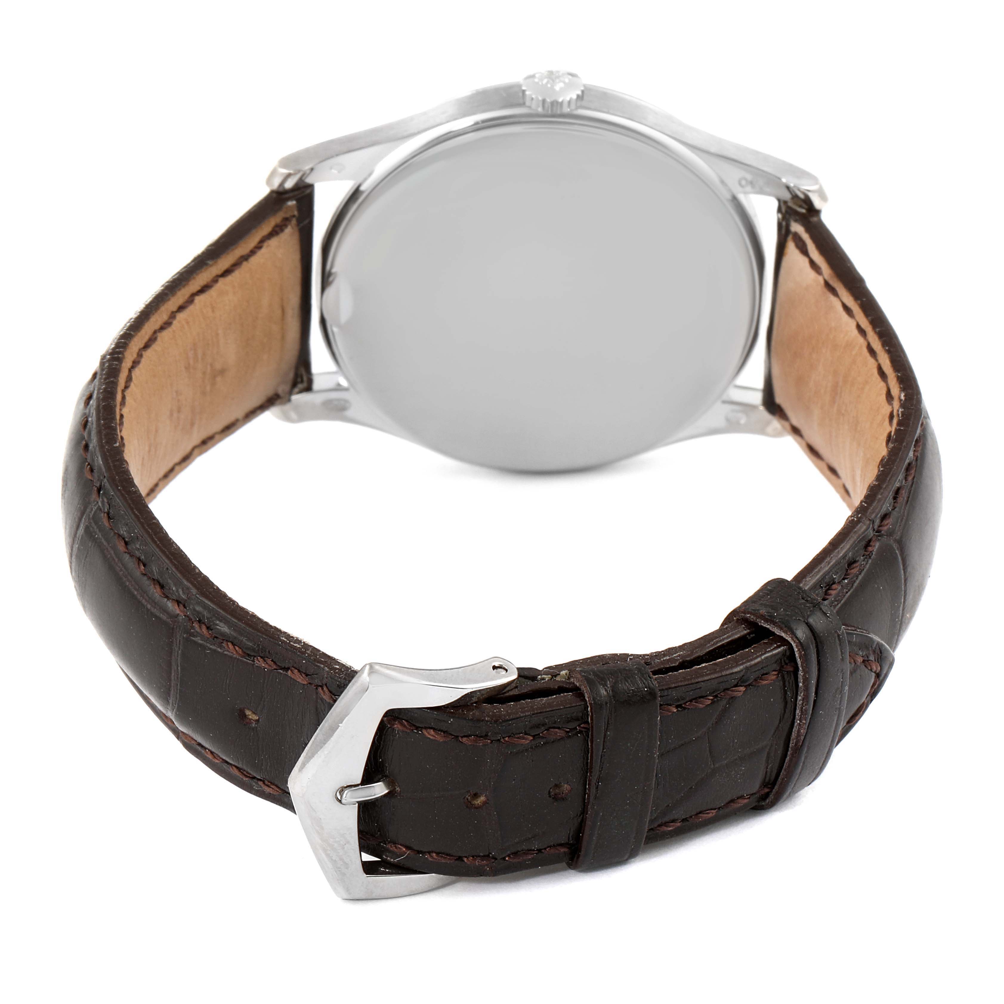The image shows the back view of a Patek Philippe Calatrava 5196G Men's White Gold Silver Dial 5196G Men's White Gold Silver Dial watch with dark leather straps and a silver buckle.