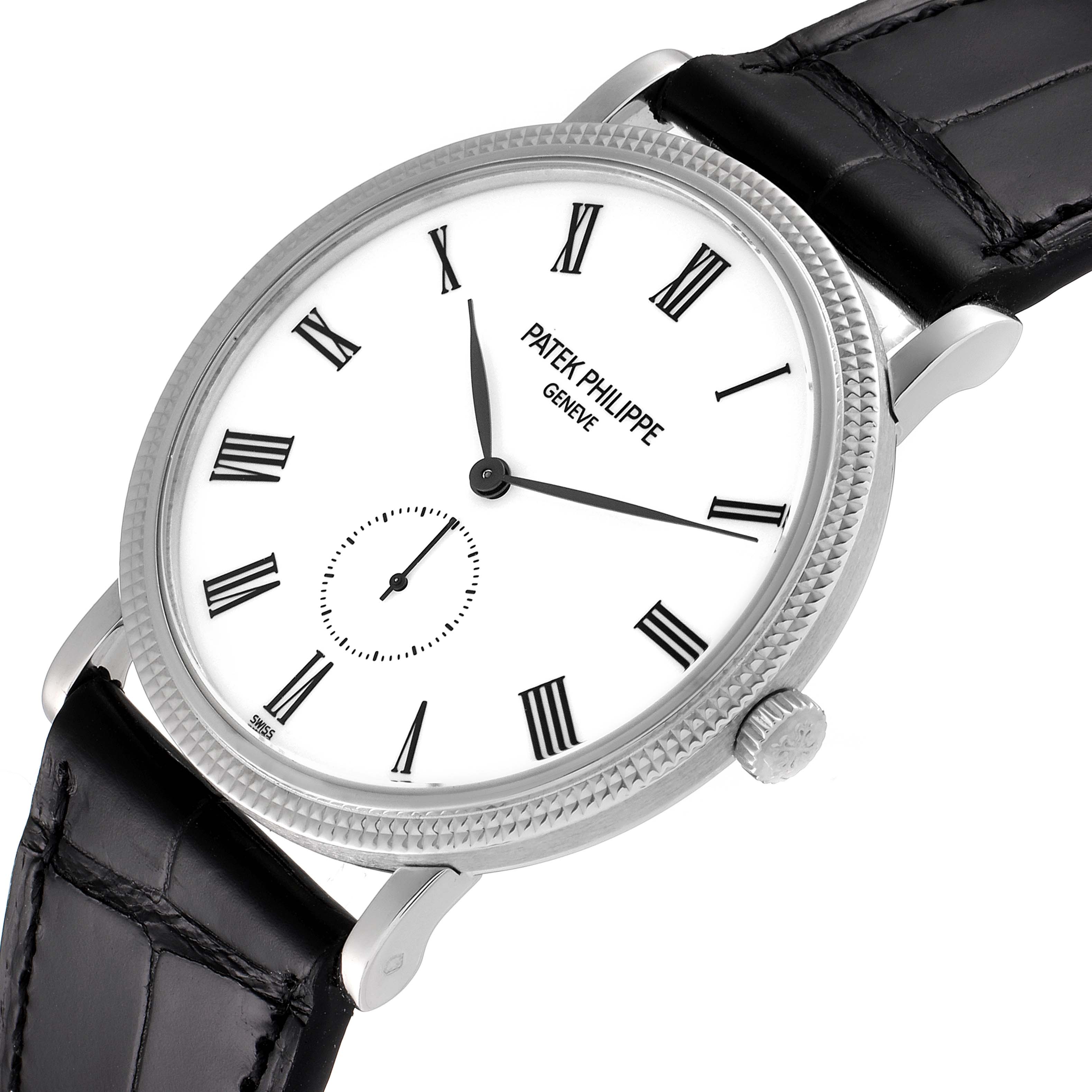 The Patek Philippe Calatrava 5119G Men
s White Gold White Dial 5119G Men
s White Gold White Dial watch is shown at an angled view, highlighting the face, bezel, crown, lugs, and leather strap.