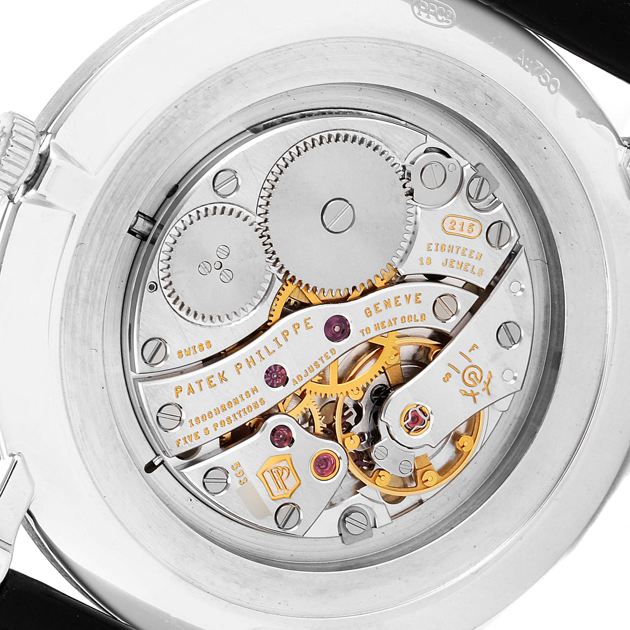The image shows a close-up view of the movement and inner workings of the Patek Philippe Calatrava 5119G Men
s White Gold White Dial 5119G Men
s White Gold White Dial model watch.