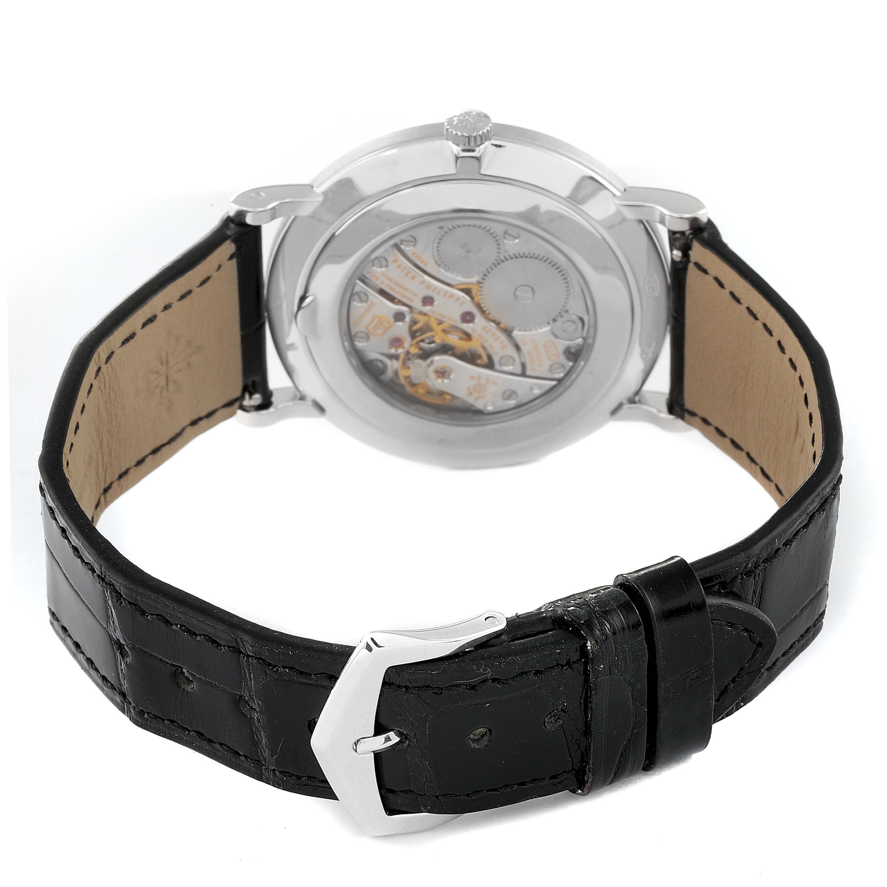 This image shows the back view of a Patek Philippe Calatrava 5119G Men
s White Gold White Dial 5119G Men
s White Gold White Dial watch, highlighting the movement and black leather strap.