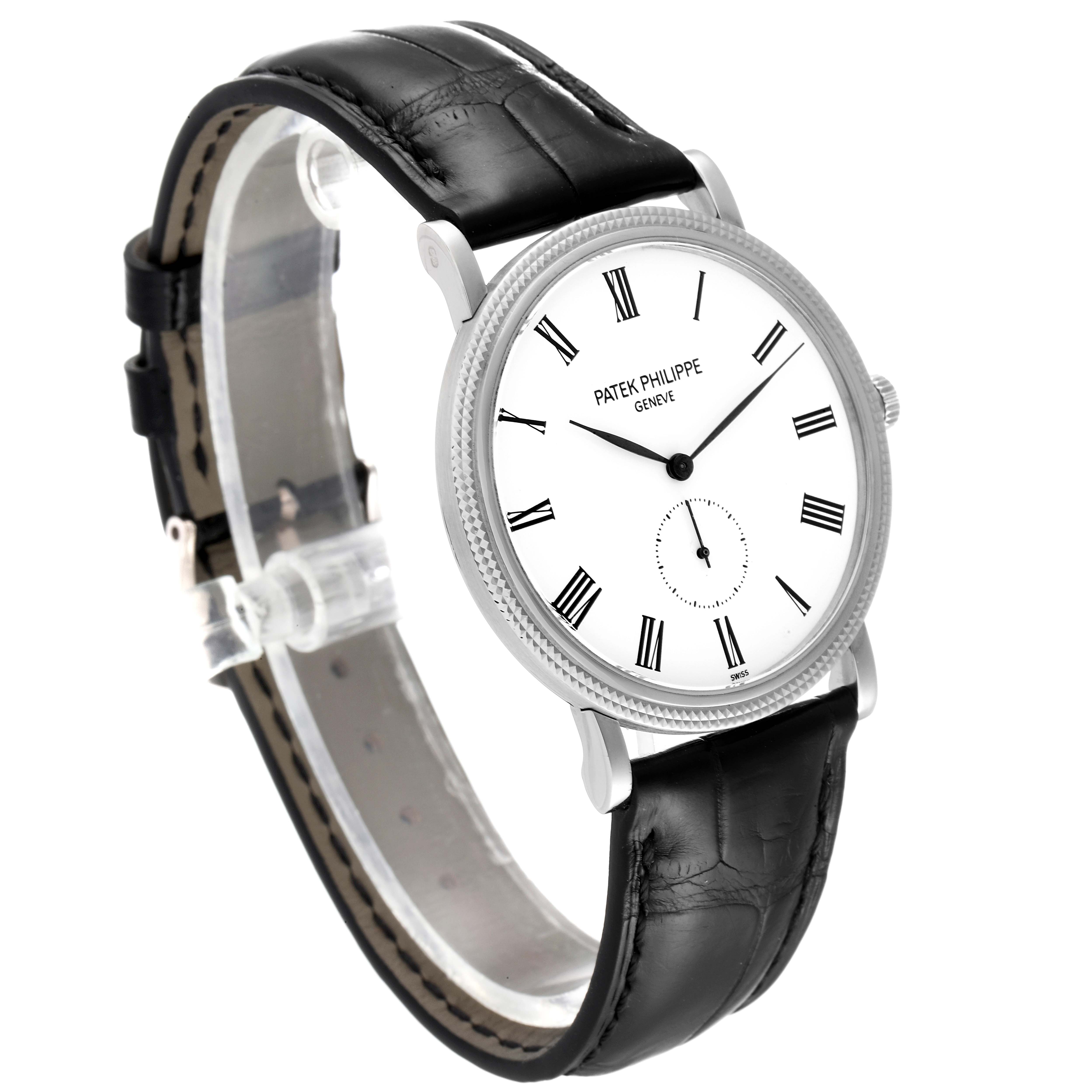 The image shows a side angle of a Patek Philippe Calatrava 5119G Men
s White Gold White Dial 5119G Men
s White Gold White Dial watch, highlighting the black leather strap and white dial with Roman numerals.