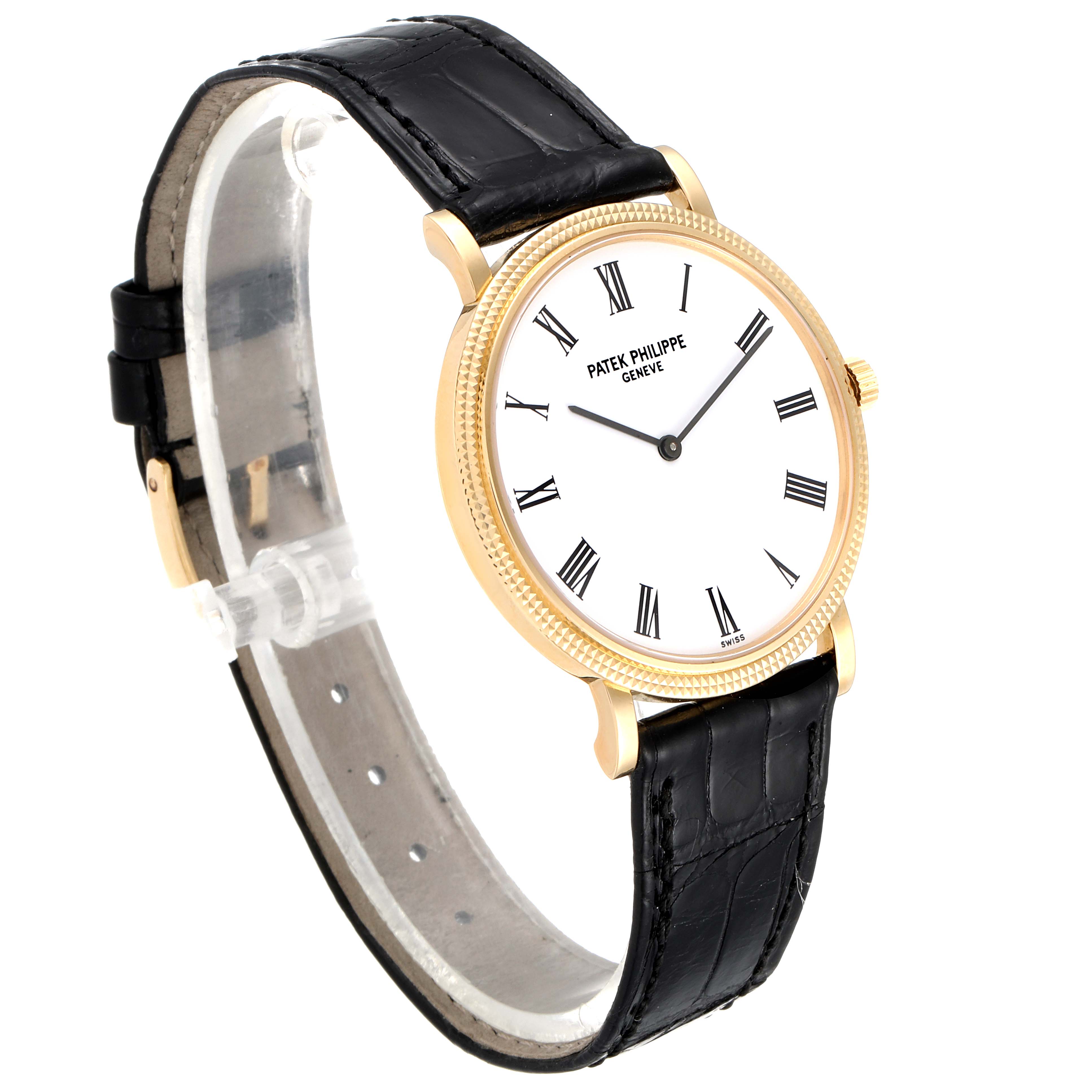 The image shows a Patek Philippe Calatrava 5120J Men's Yellow Gold White Dial 5120J Men's Yellow Gold White Dial watch at a three-quarter angle, highlighting its dial, case, and leather strap.