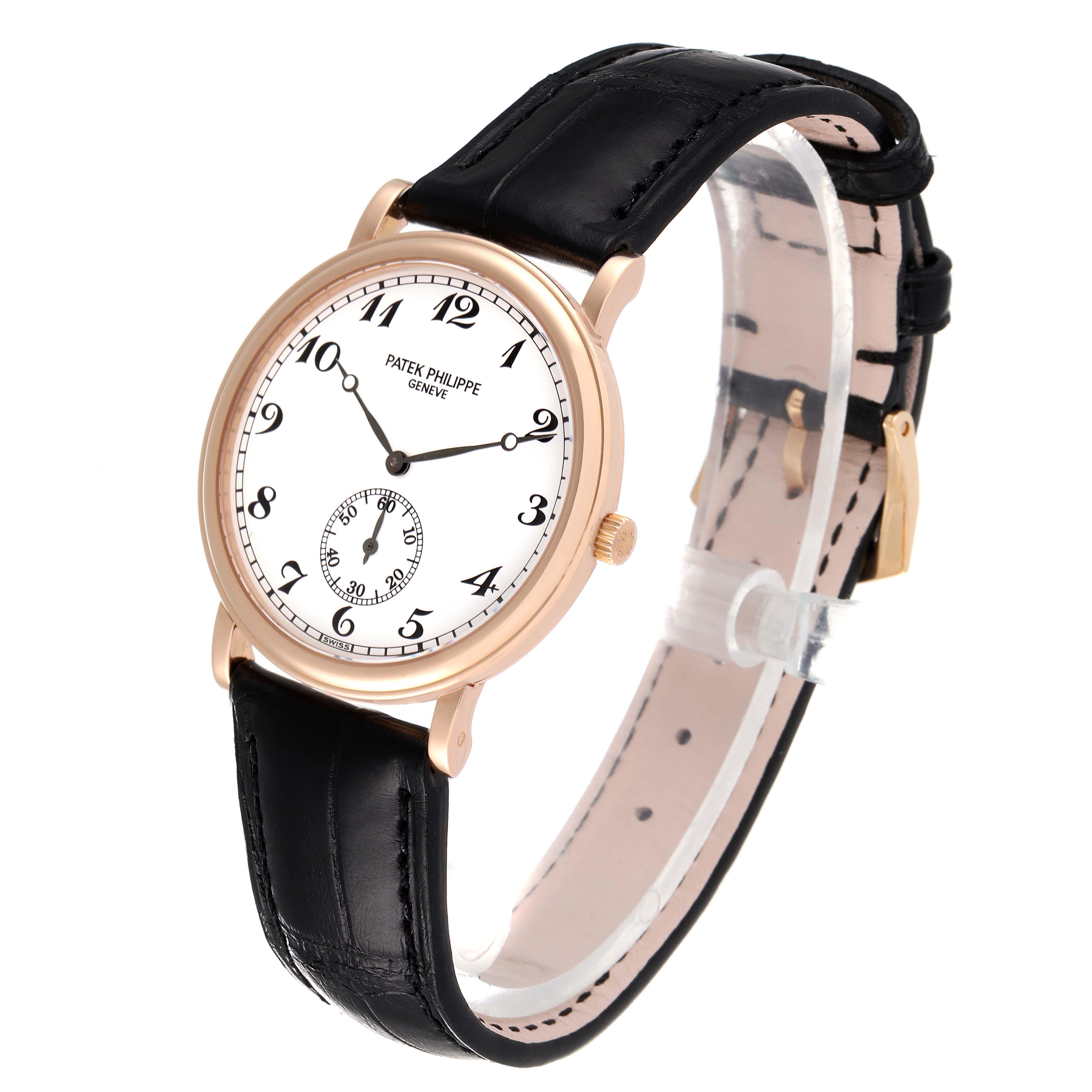 This image shows a Patek Philippe Calatrava 5022R Men
s Rose Gold White Dial 5022R Men
s Rose Gold White Dial watch from a front-side angle, detailing its face, case, and strap.