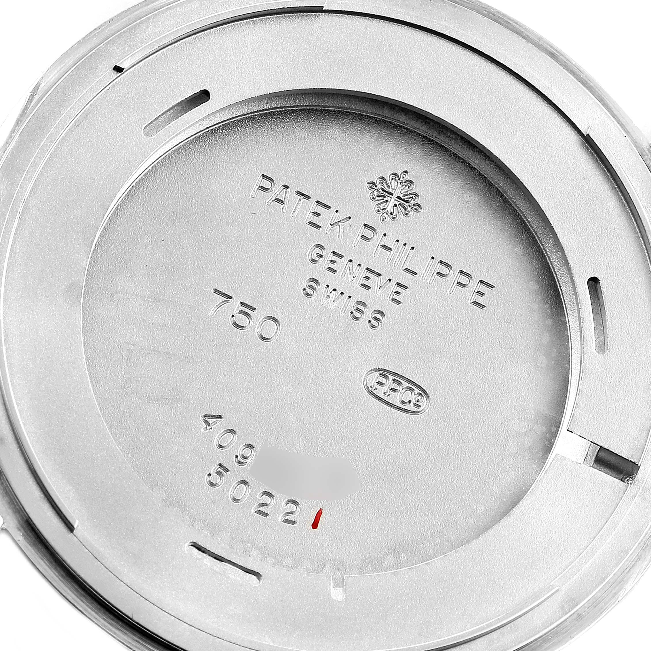 This image shows the back case of a Patek Philippe Calatrava 5022G Men's White Gold White Dial 5022G Men's White Gold White Dial watch, engraved with brand details and serial numbers.