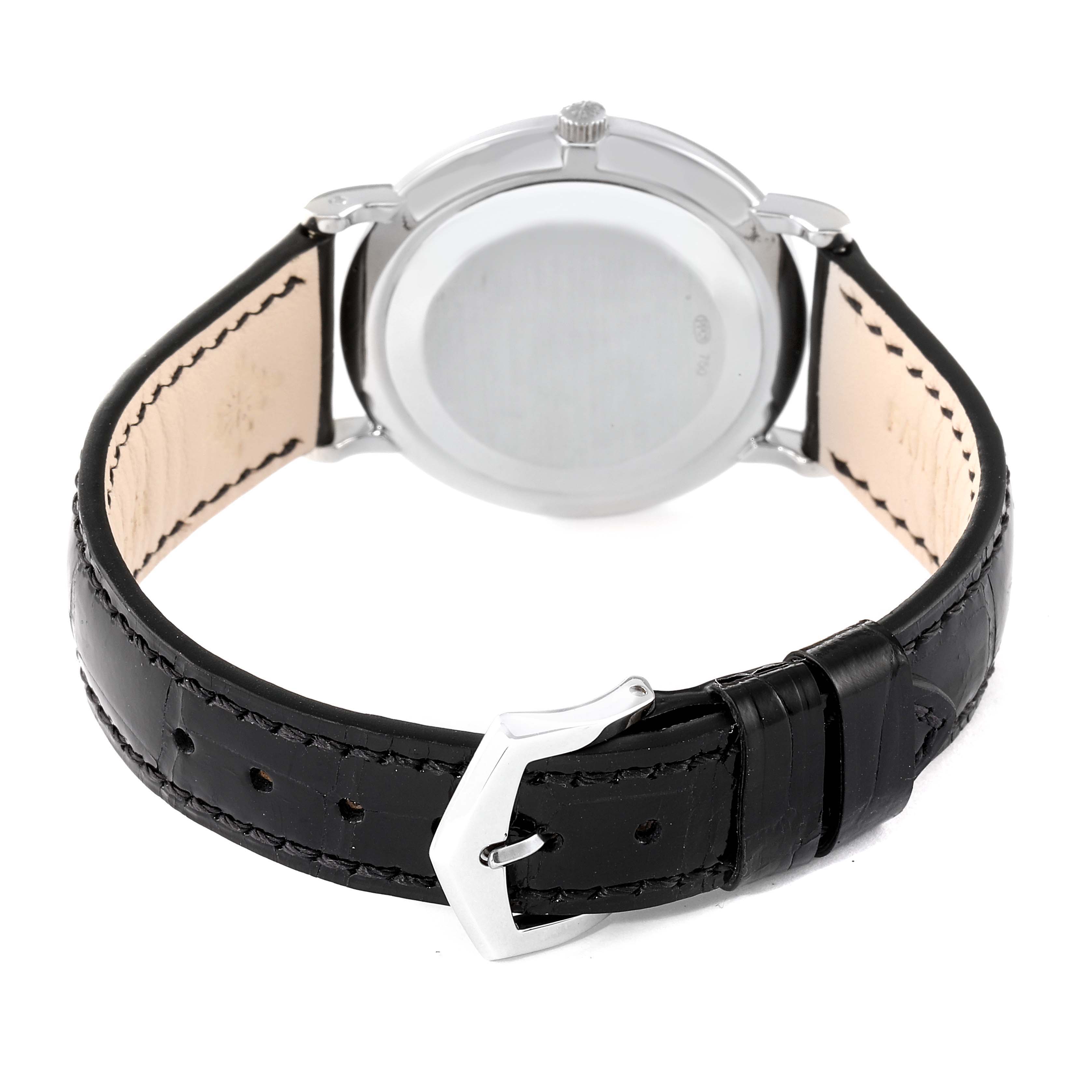 The image shows the back view of a Patek Philippe Calatrava 5022G Men's White Gold White Dial 5022G Men's White Gold White Dial watch, highlighting its case and leather strap.