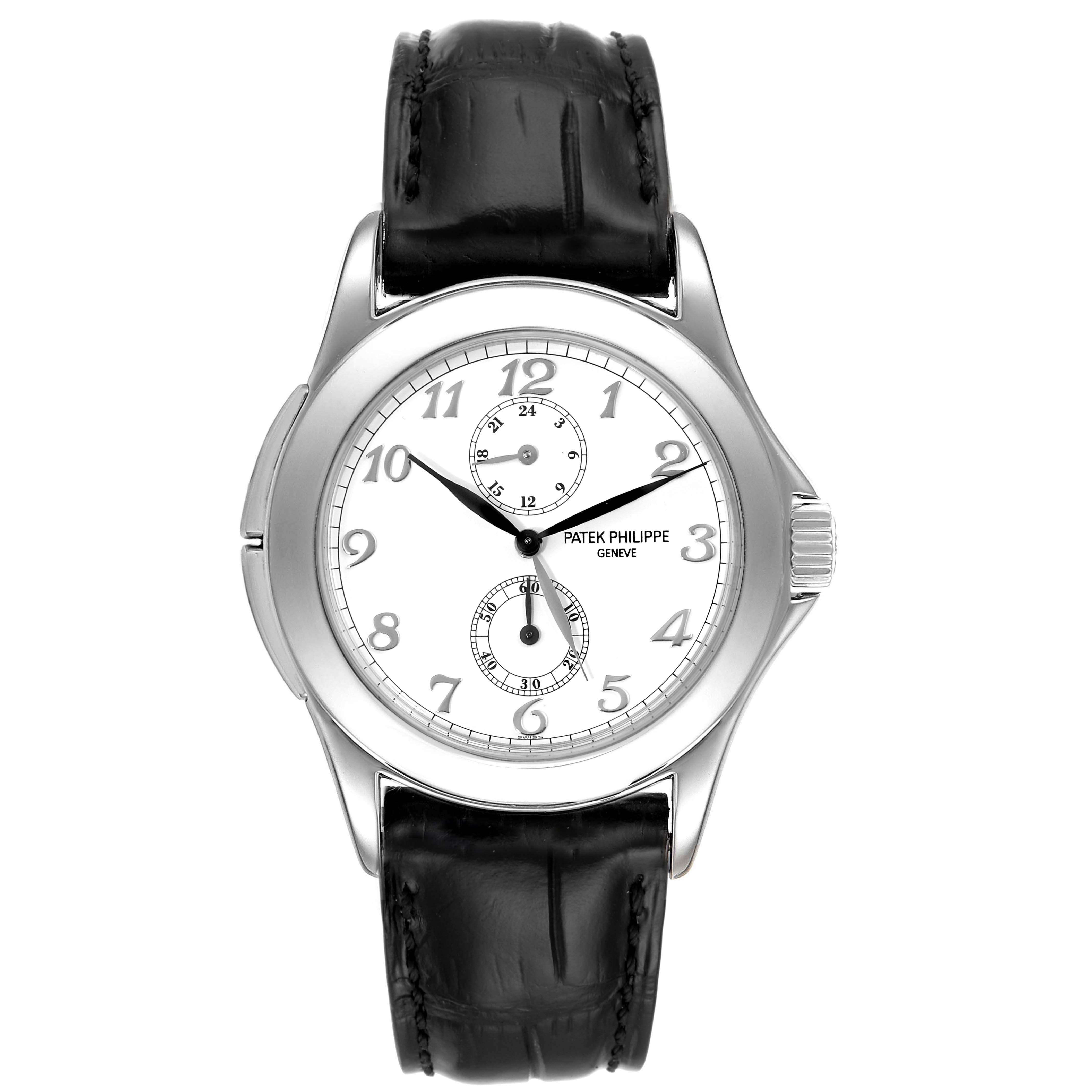 The image shows a front view of a Patek Philippe Calatrava 5134G Men
s White Gold White Dial 5134G Men
s White Gold White Dial watch, featuring its dial, hands, and leather strap.