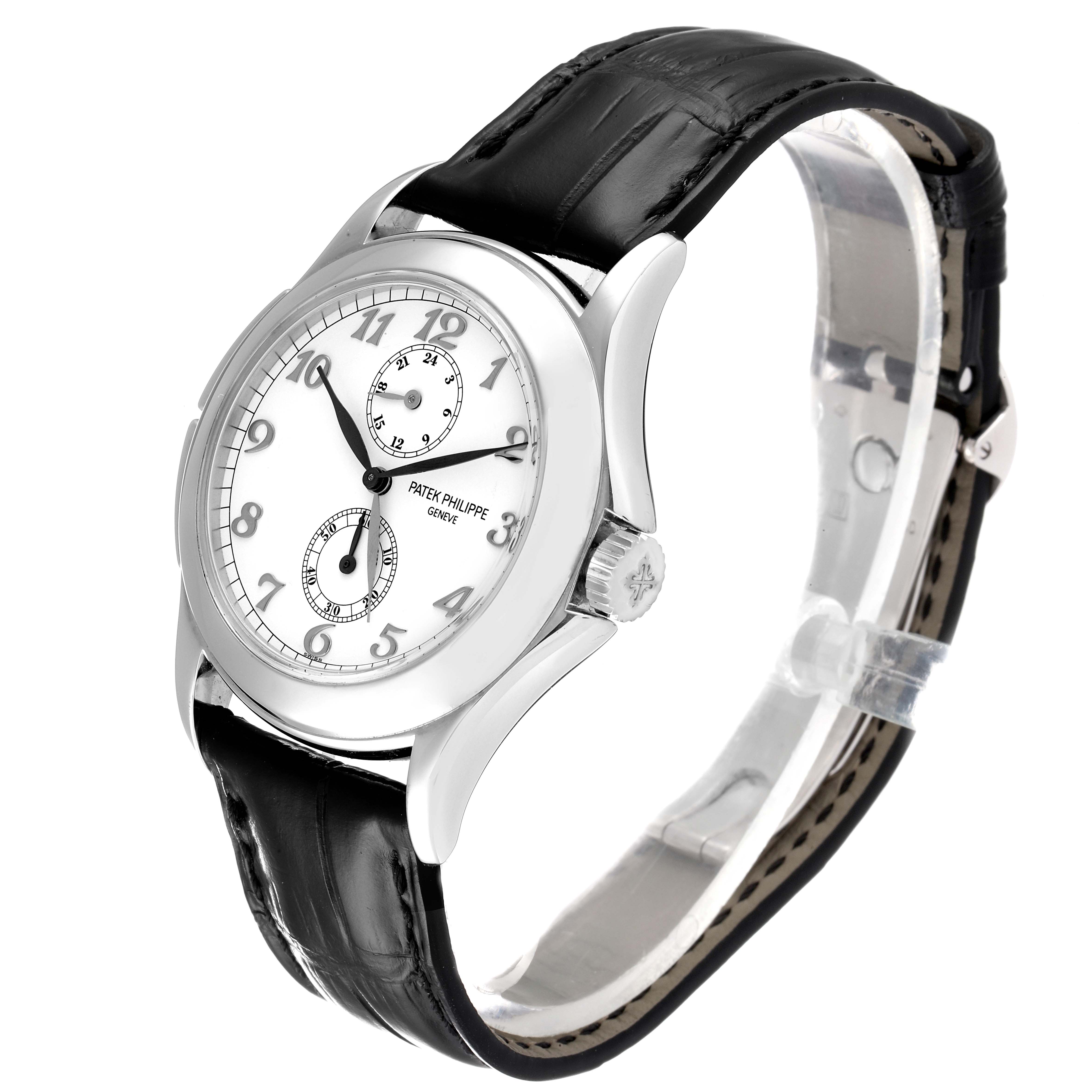 The image shows a Patek Philippe Calatrava 5134G Men
s White Gold White Dial 5134G Men
s White Gold White Dial watch from an angled side view, displaying the face, bezel, crown, and leather strap.